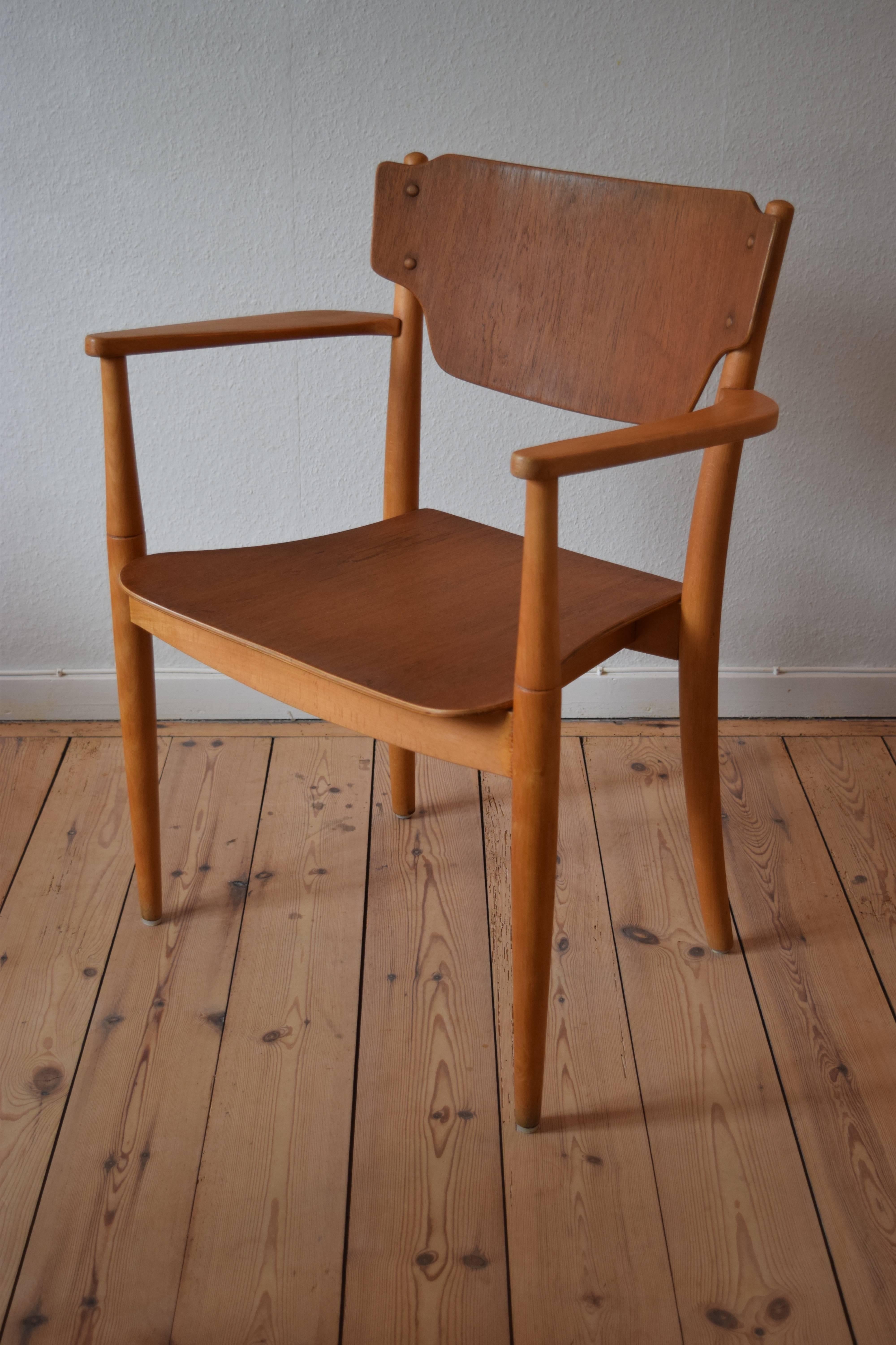 This 'Portex' chair was designed by Peter Hvidt & Orla Mølgaard-Nielsen in 1944, and was manufactured in Denmark. It was originally designed as stacking armchair, and was one of the first stacking chairs designed in Denmark. it remains in a very