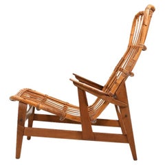 Sillón danés de ratán con reposabrazos de teca Años 50