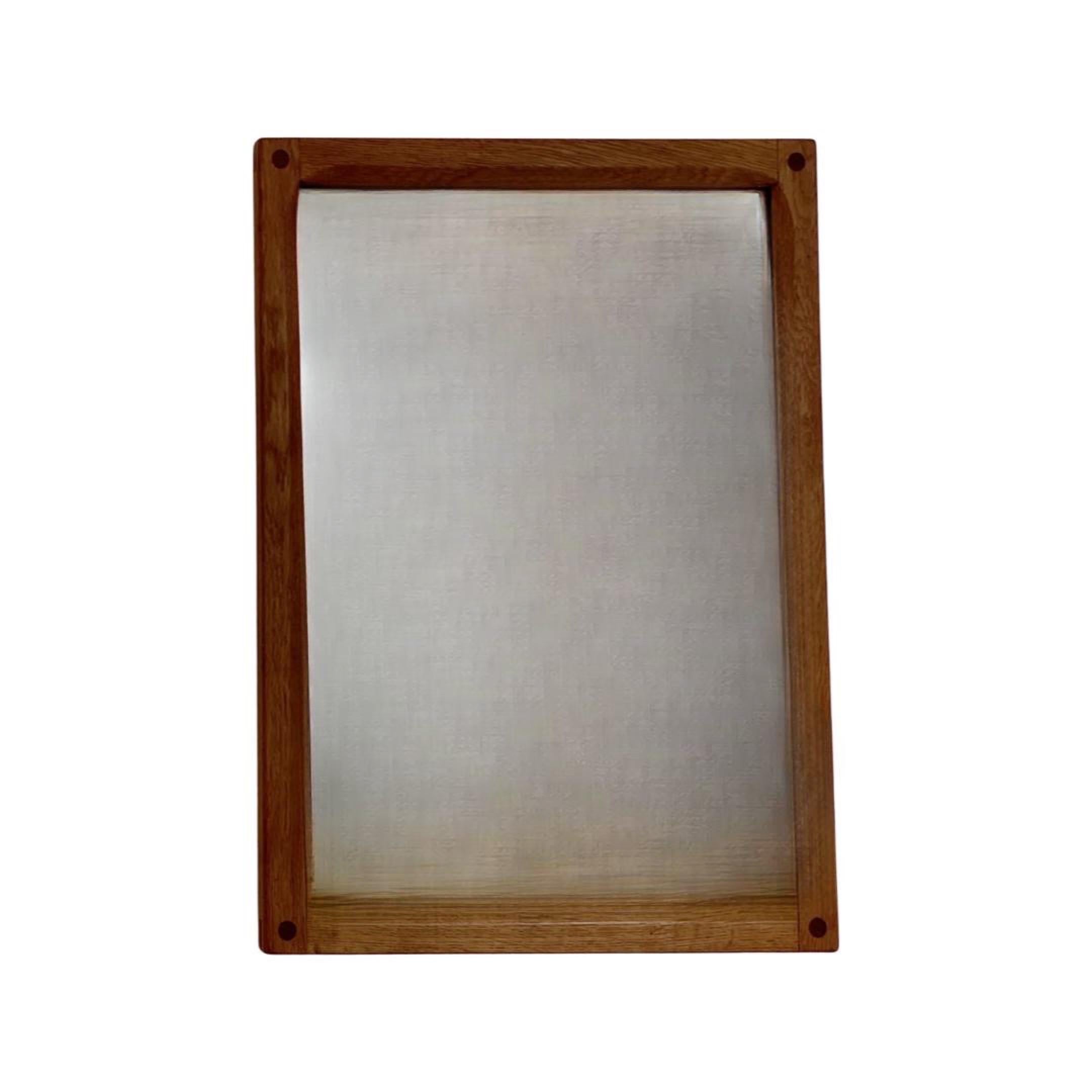 Scandinavian Modern rectangular wall mirror by Kai Kristiansen, Denmark circa 1960's

This iconic teak and oak mirror is a Model 161 by famous Danish carpenter Aksel Kjersgaard, from the small town Odder.
from Odder. These mirrors were made on order