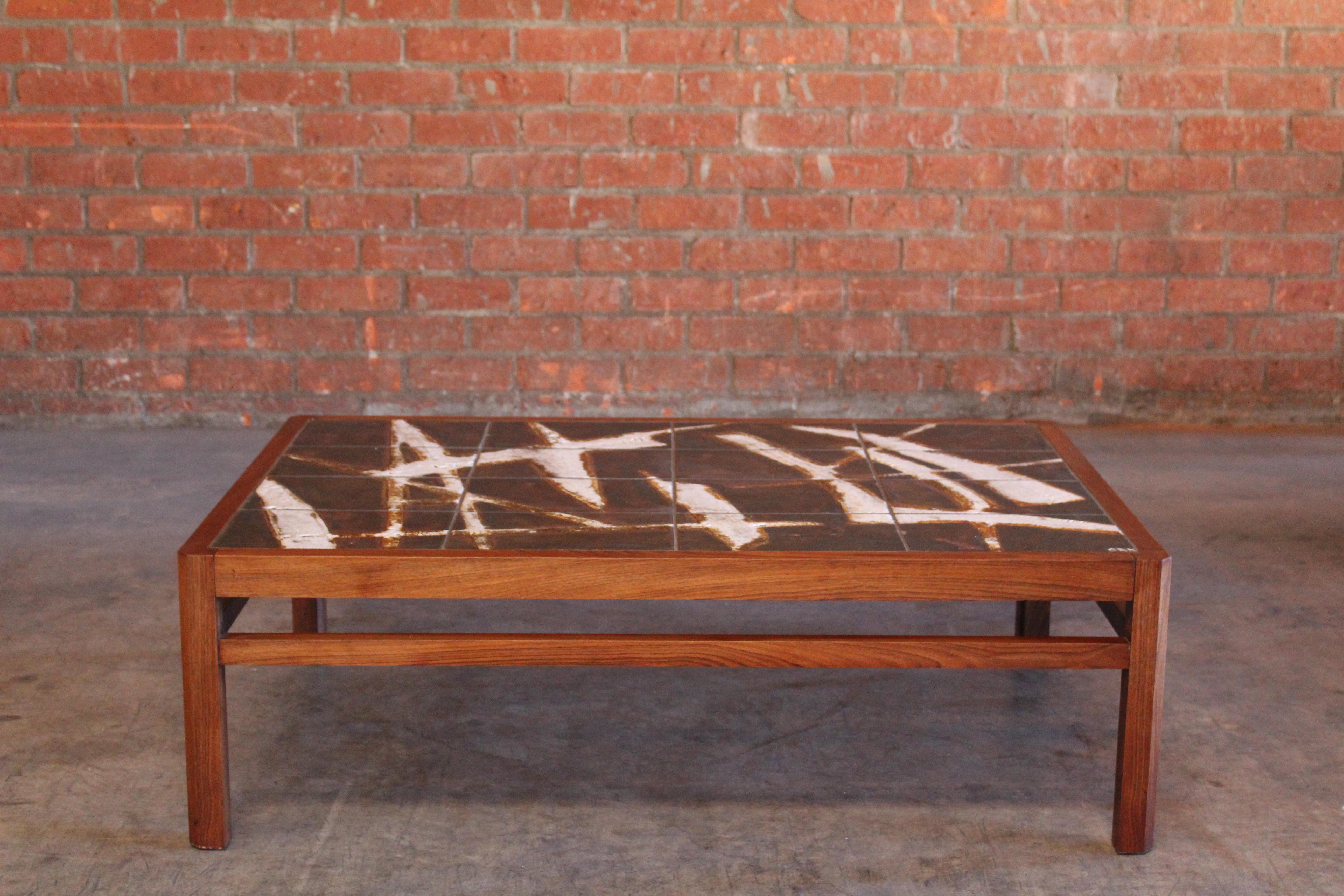 Vintage 1960s solid rosewood coffee table with abstract ceramic tiles designed by Ole Bjorn Krüger. In over all excellent condition.