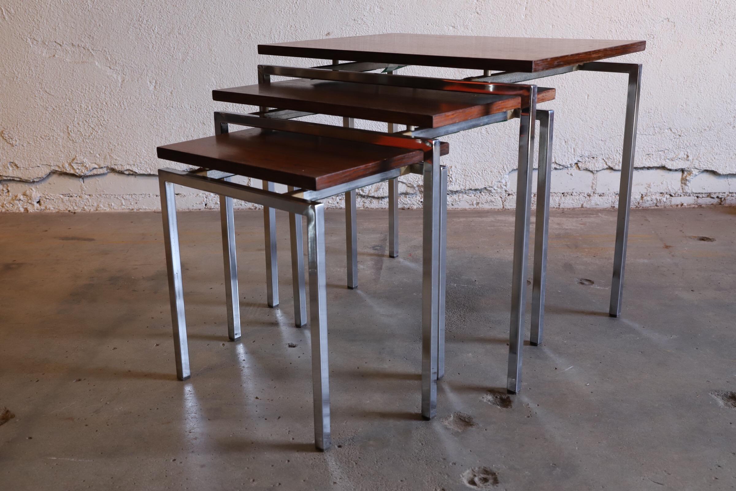 Unique & fun Rosewood nesting tables - (3) sizes with (3) different tint shaded floating tops. Danish in design. Slender chrome legs. Fantastic add to any side chair or sofa.