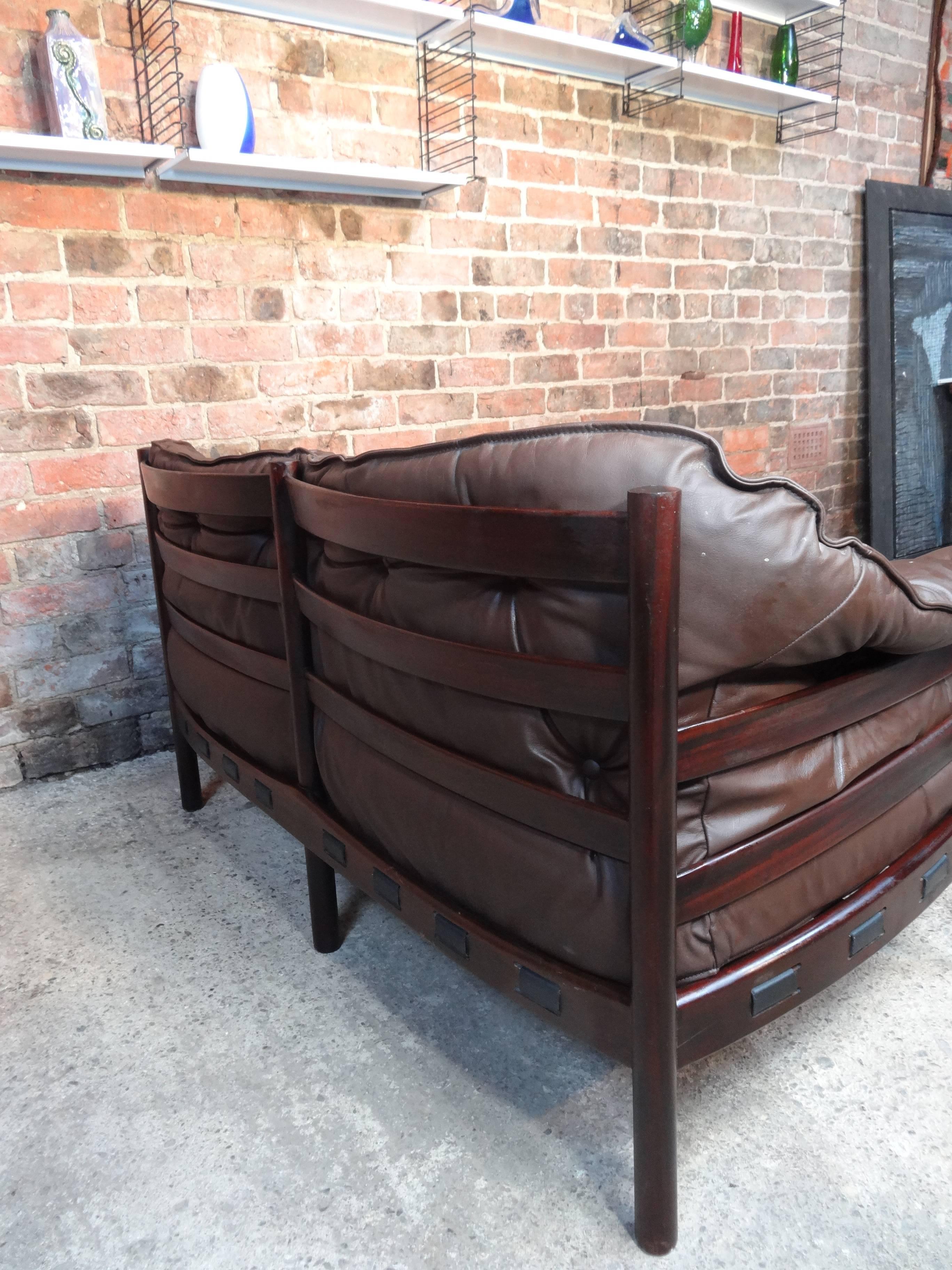 Great Arne Norell brown leather sofa is in very good vintage condition, leather is in very good condition as well, this Classic Danish sofa are the antiques of the future and look great in any decor.

Measures: Seat height 45cm, height 70cm, depth
