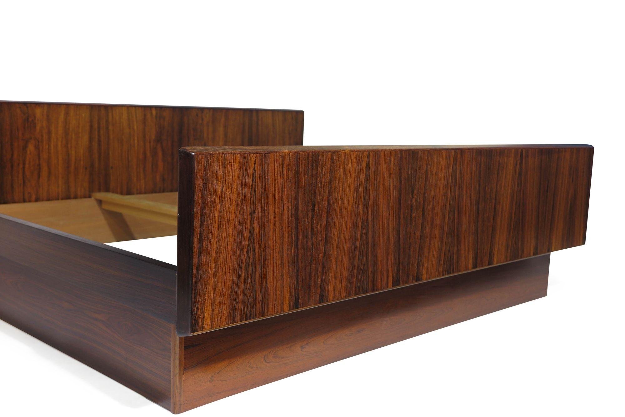 1950's Hans Olsen Danish bed-frame with floating nightstands crafted of Brazilian rosewood.
 
 
Dimensions: Headboard 104