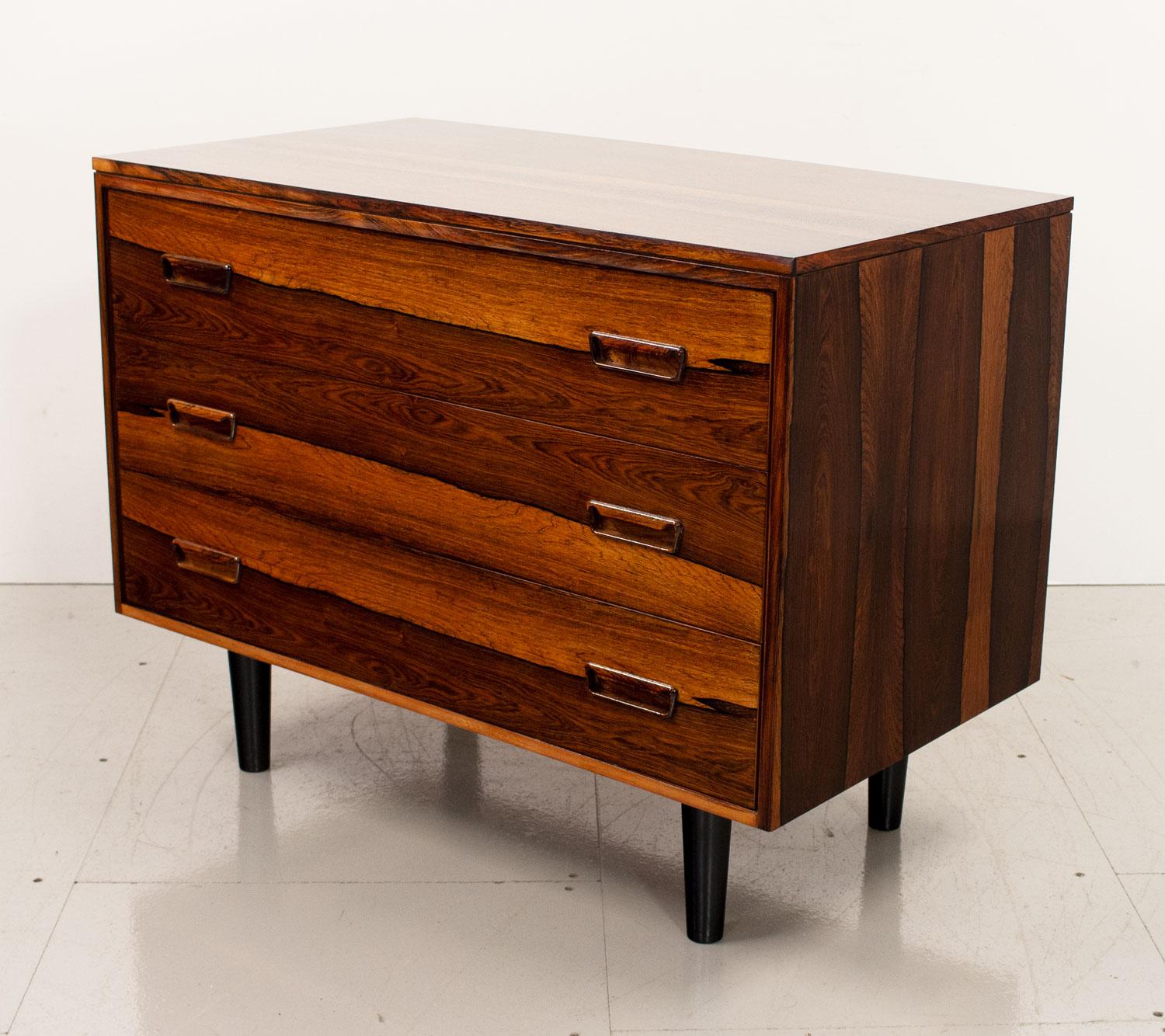1960s Danish  rosewood chest of drawers designed in the manner of Arne Wahl Iversen. Made of a beautiful Brazilian rosewood with a stunning grain it has 3 good sized drawers on back legs.