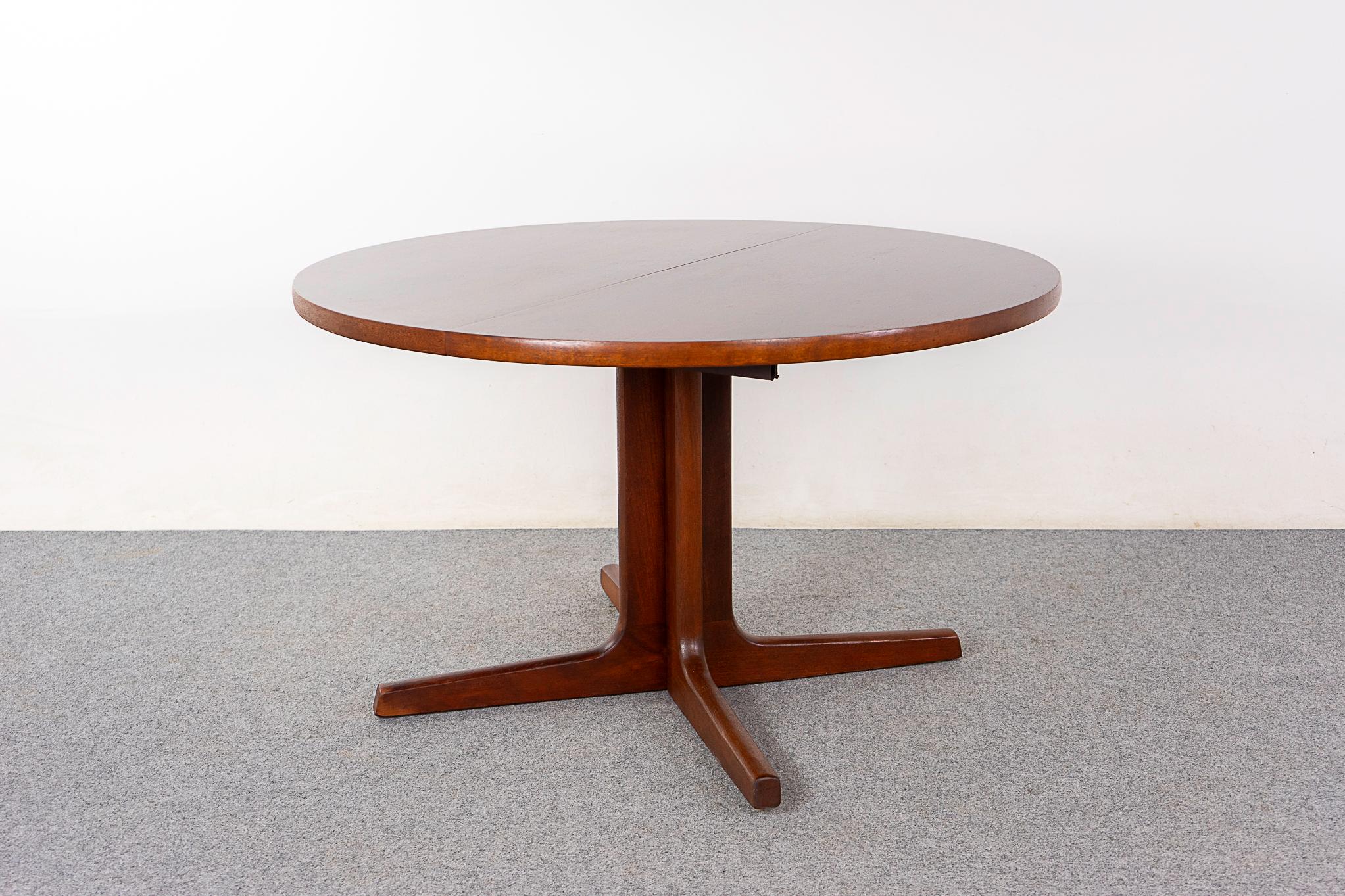 Rosewood Danish dining table, circa 1990's. Sculpted pedestal base opens with the table top to increase the stability when extended. Perfect for 4 or 6 guests!

Restoration unavailable, sold as is. 

Made in Denmark
Circa 1990's
48