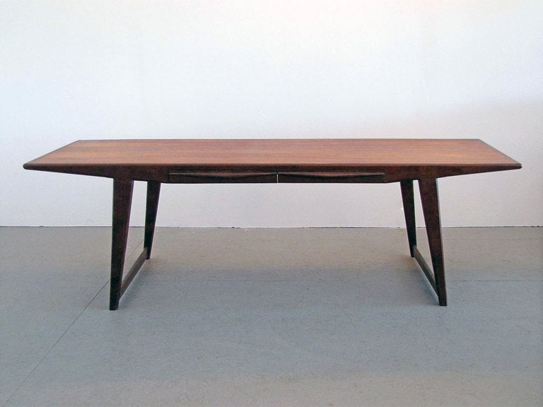 Beautiful rosewood coffee table by Johannes Andersen with two sculptural drawers seamlessly integrated in the tabletop.
