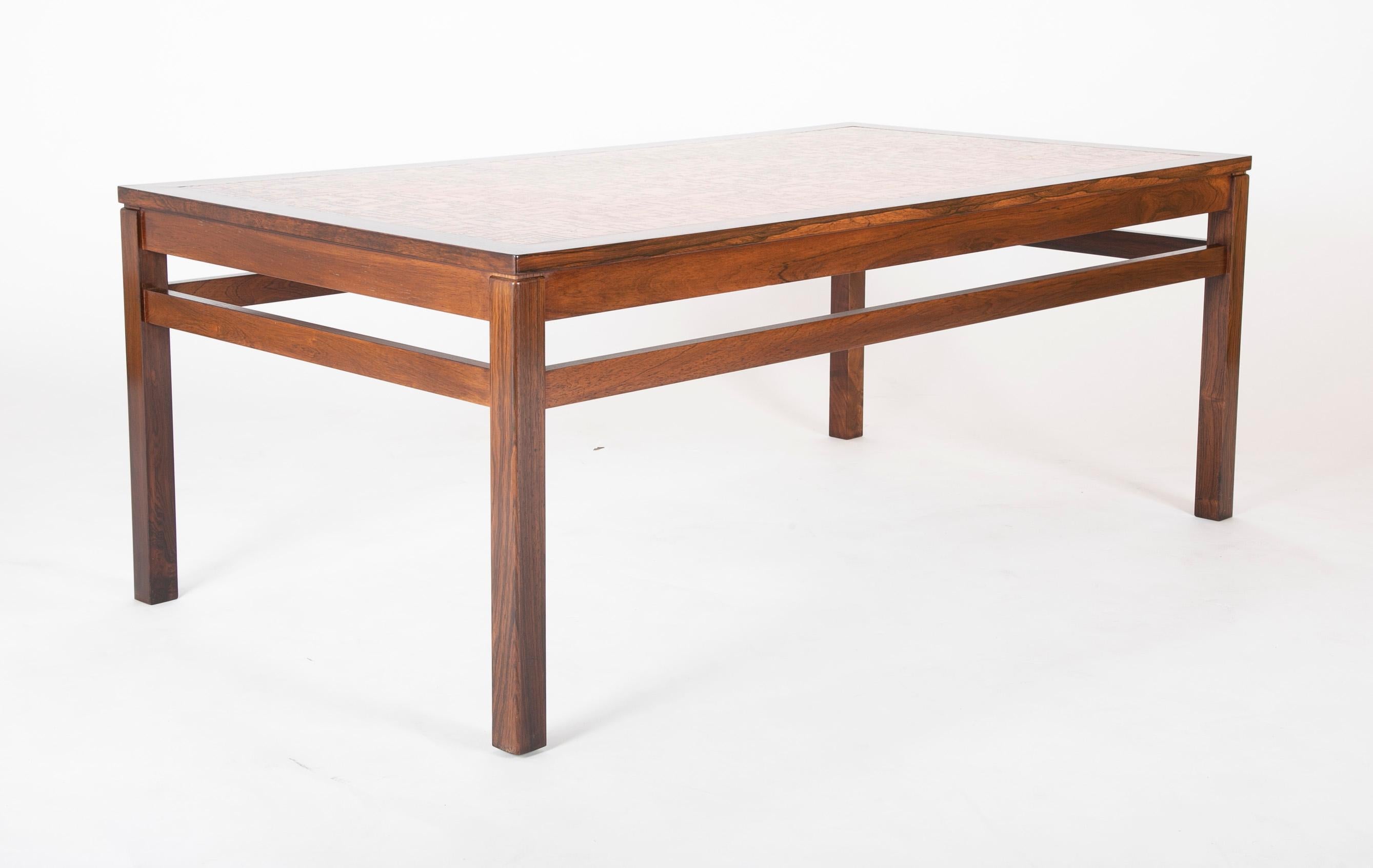A Danish rosewood coffee table with etched copper top, circa 1970.