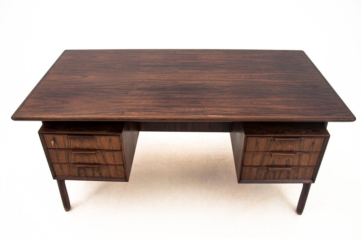 Rosewood desk made in Denmark in the 1960s. Designed by the well-known Danish designer - Gunni Omann. Desk in very good condition. The price includes renovation.

Dimensions: height 73 cm / width 154 cm / depth 80 cm.