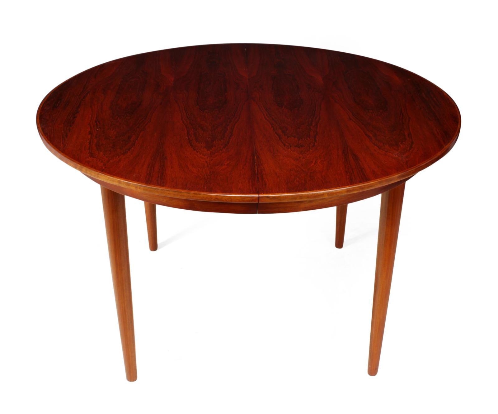 Danish rosewood dining table
This circular dining table has two extending leaves to seat 8 people each leaf is 50cm wide the table has been professionally hand polished and is in excellent conditioned

Age: 1960

Style: Mid-Century