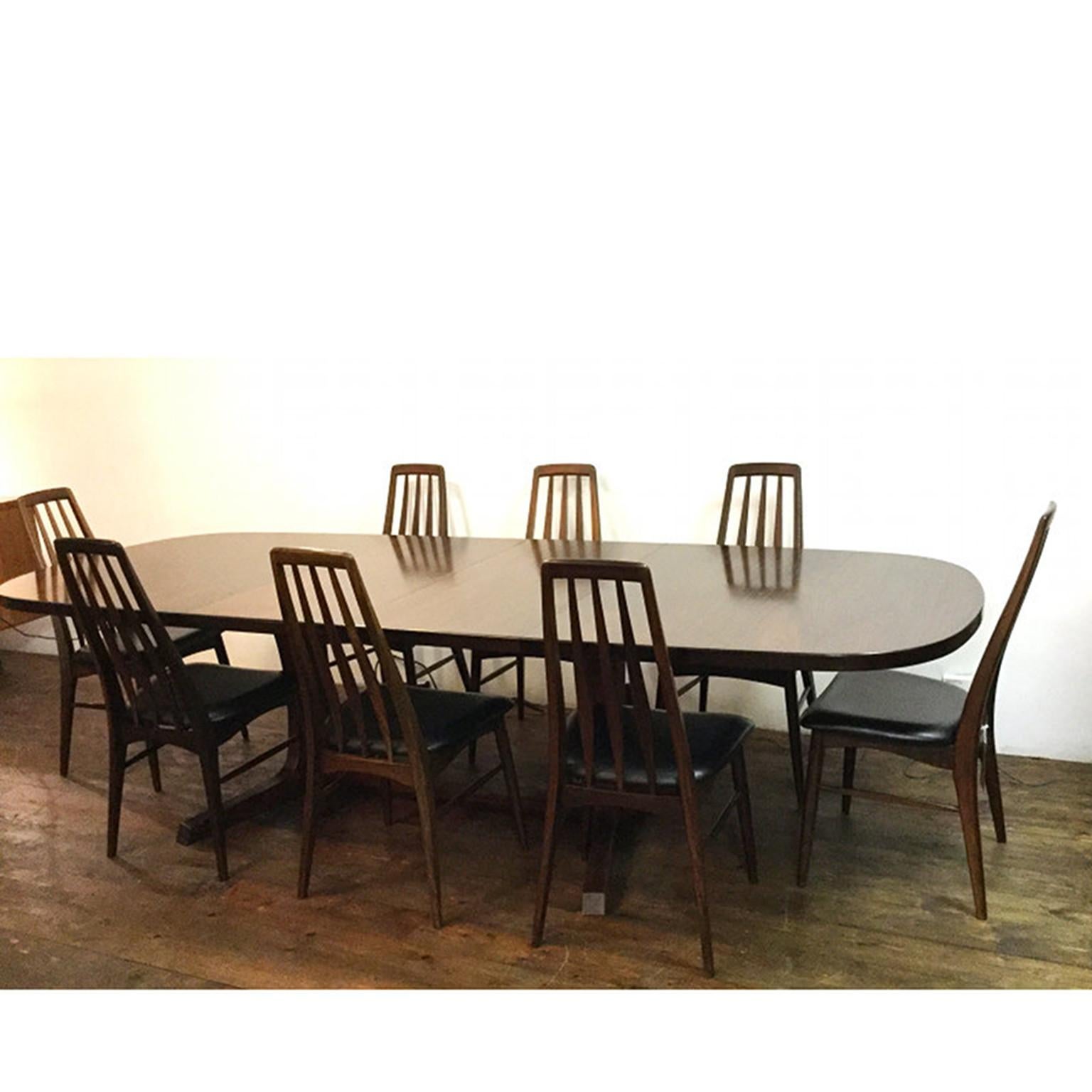 Danish extendable rosewood dining table with eight “Eva” chairs
(Very comfortable seat and rare to find in rosewood)
Designed by Niels Koefoed and manufactured by Koefoeds Hornslet
This dining set was sold through Harrods and also high quality