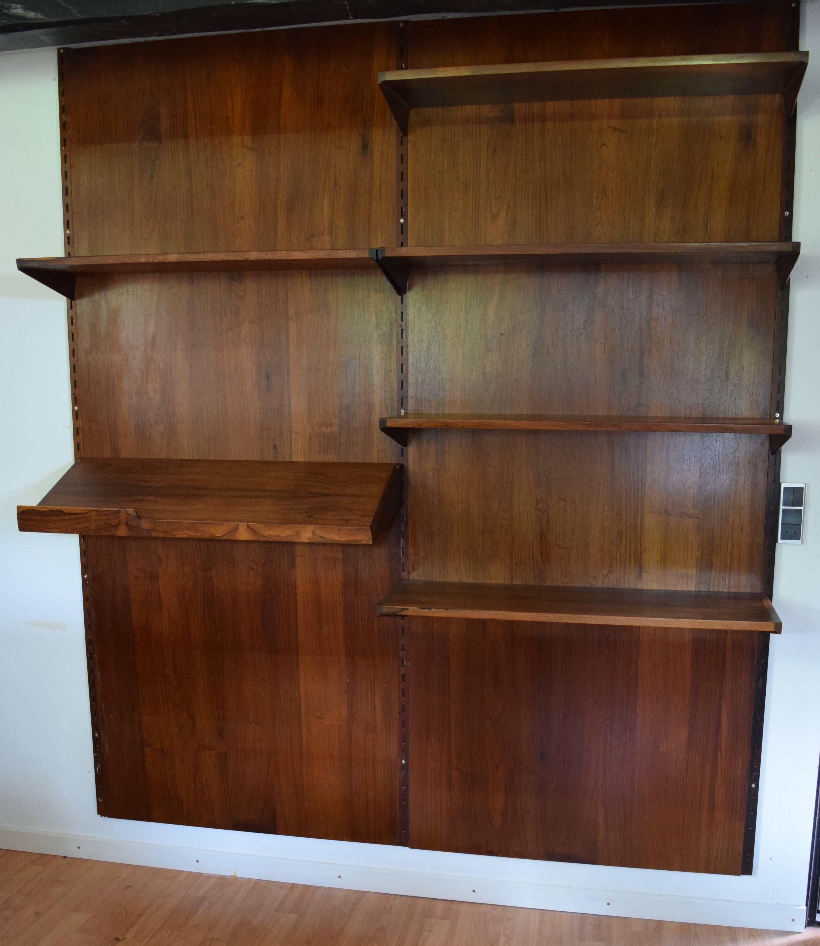 Set of six rosewood shelves by Kai Kristiansen and manufactured by FM Møbler, Denmark from the 1960s. This system comprises of five height adjustable small shelves, a magazine shelf and three hanging rails. The rosewood back-plates are not included,