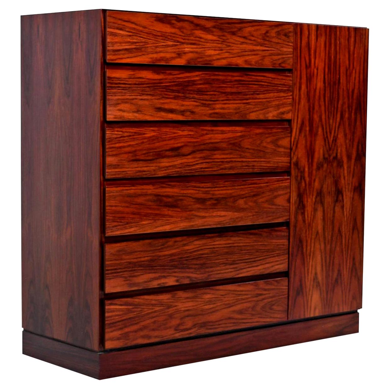 Scandinavian inspired minimalism at its best. The rosewood veneers are rich and dark with flaring cathedral grain. High end Scandinavian cabinet shop construction inside and out with dovetail joinery on the solid beechwood interior drawers. Designed