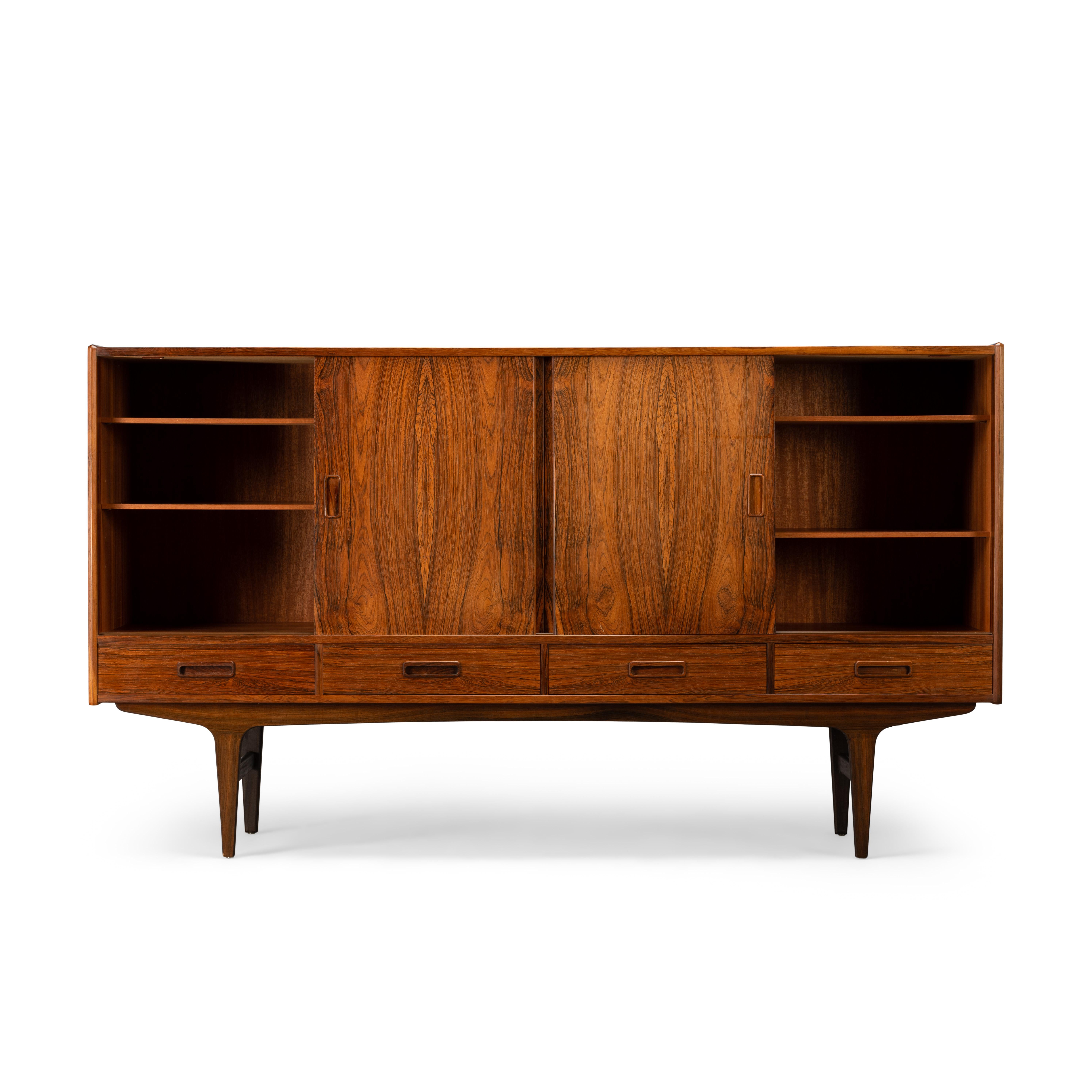 This is a sideboard designed by Borge Sendal and manufactured P. Westergaard Møbelfabrik in Denmark toward the end of the 1960s. Actually on January 9th of that year per the note on the back of the sideboard. Finished in beautiful wood, with lively