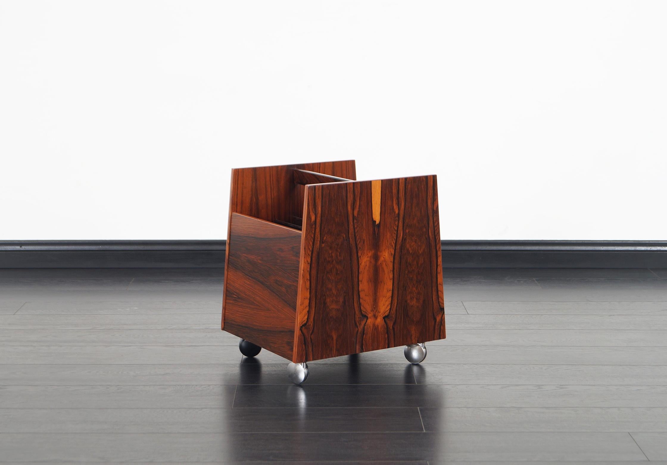 Danish Brazilian rosewood magazine or record stand designed by Rolf Hesland and produced by Bruksbo in Norway, circa 1960s.