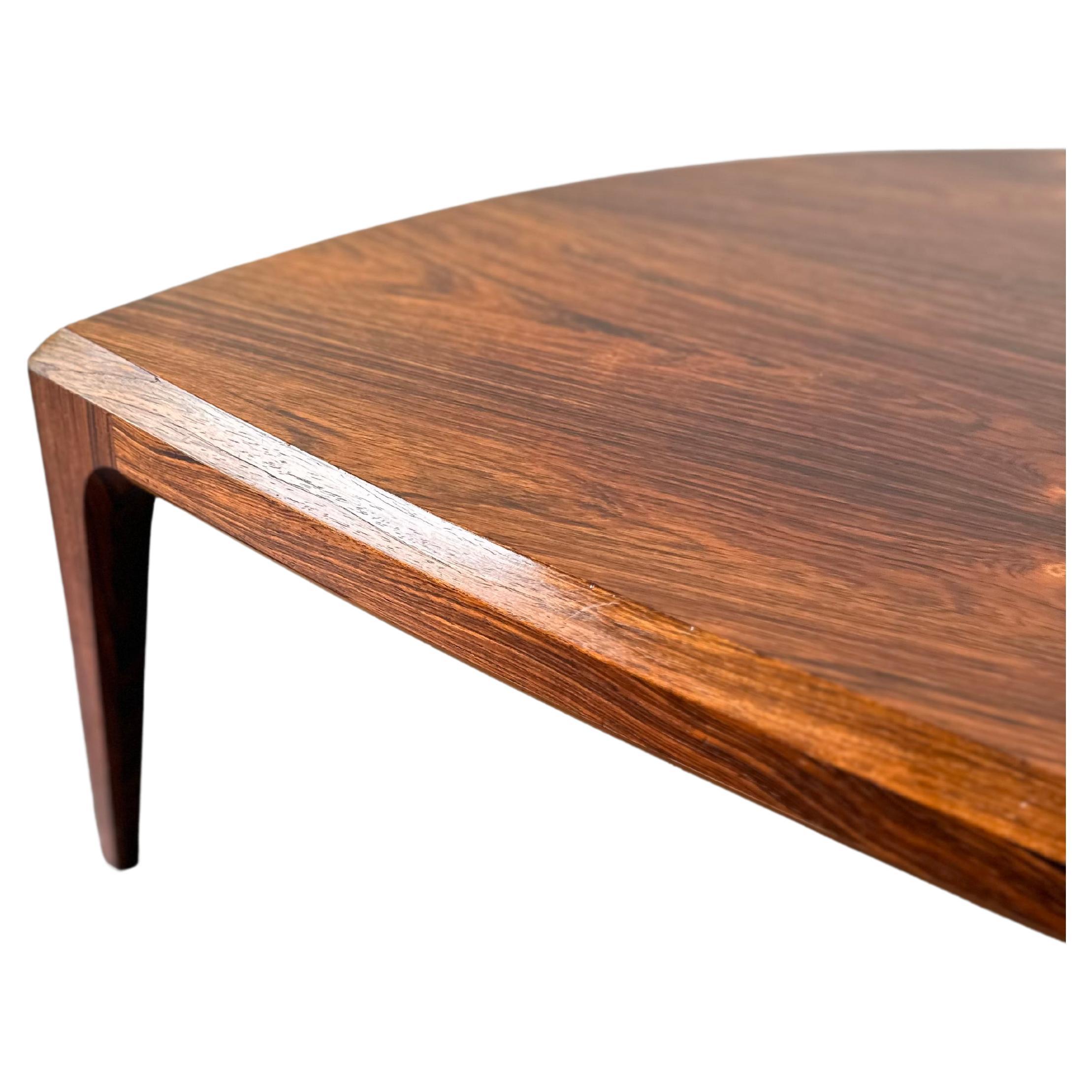 Danish Rosewood MCM Half Moon Coffee Table By Johannes Andersen

Stunning Danish Modern Rosewood Coffee Table, featuring a signature minimalist design, clean lines, and three tapered style legs. 

Danish rosewood furniture is known for its rich,