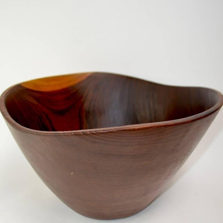 Sculptural organic form, Danish modern salad bowl, unusual to see these in rosewood. This example is in good original condition showing some light wear to interior finish, as shown.
