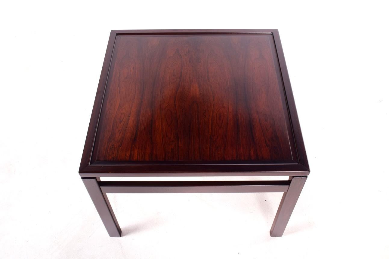 Beautiful Danish modern and perfectly proportioned rosewood side table, featuring clean and simple styling and gorgeous wood grain. Marked by maker on underside. Made in Odense, Denmark, 1966. Model 158.