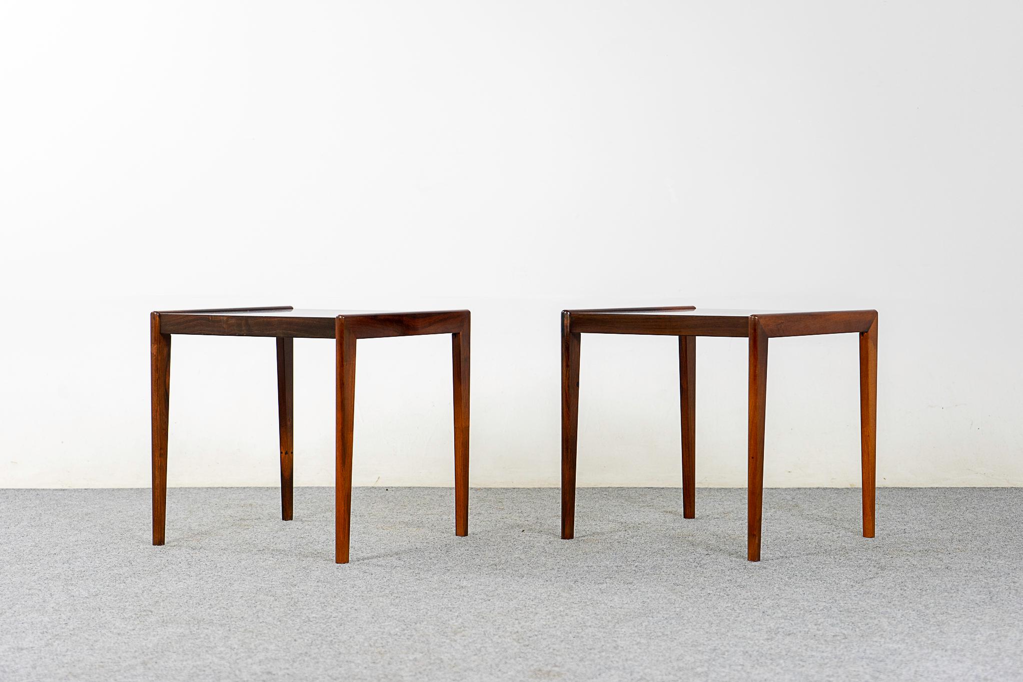 Rosewood side table pair, circa 1960's. Solid wood base and handsome book-matched veneer tops. Make the most of your space with this charming duo.

Please inquire for remote and international shipping rates.
