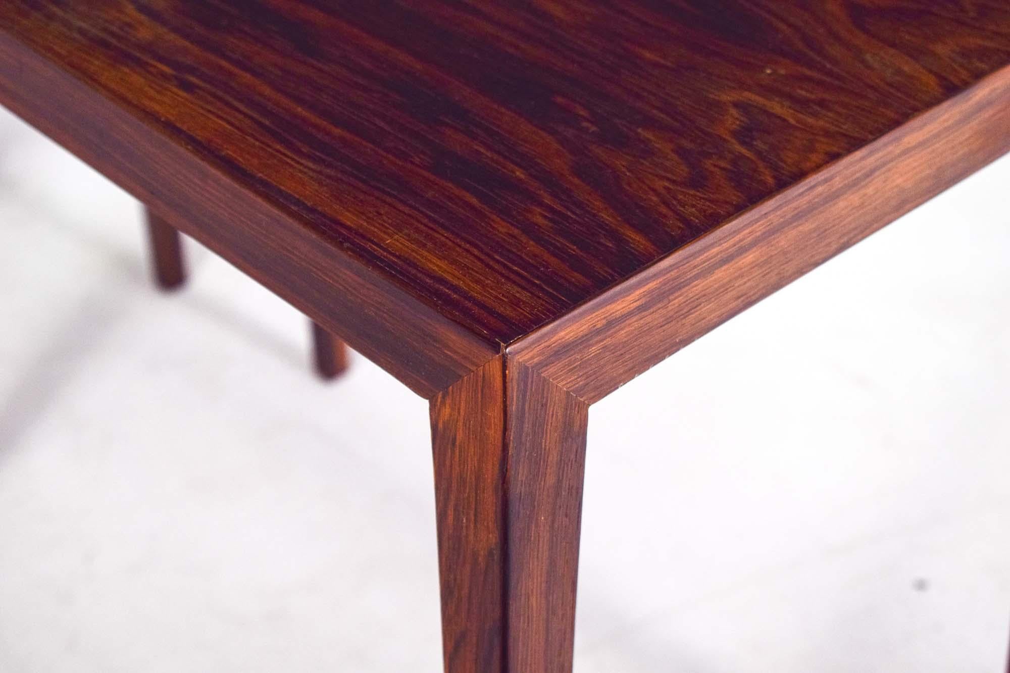A pair of rosewood side tables with beautiful handcrafted details designed by Erik Severin Hansen and produced in Denmark by Haslev in the 1960s. Pure and elegant shaped tables. These tables can also be used as bedside table. Haslev Møbelsnedkeri
