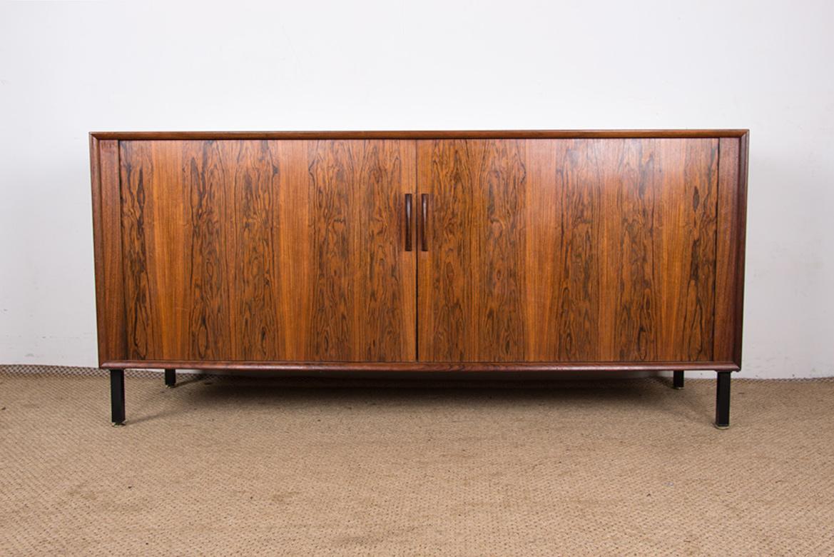 Superb little Scandinavian sideboard. 
2 large curtain doors open, on the left side, onto two interior drawers and a shelf below, on the left side a large shelf. 
Beautifully crafted furniture with a refined and very elegant design. 
Ideal for small