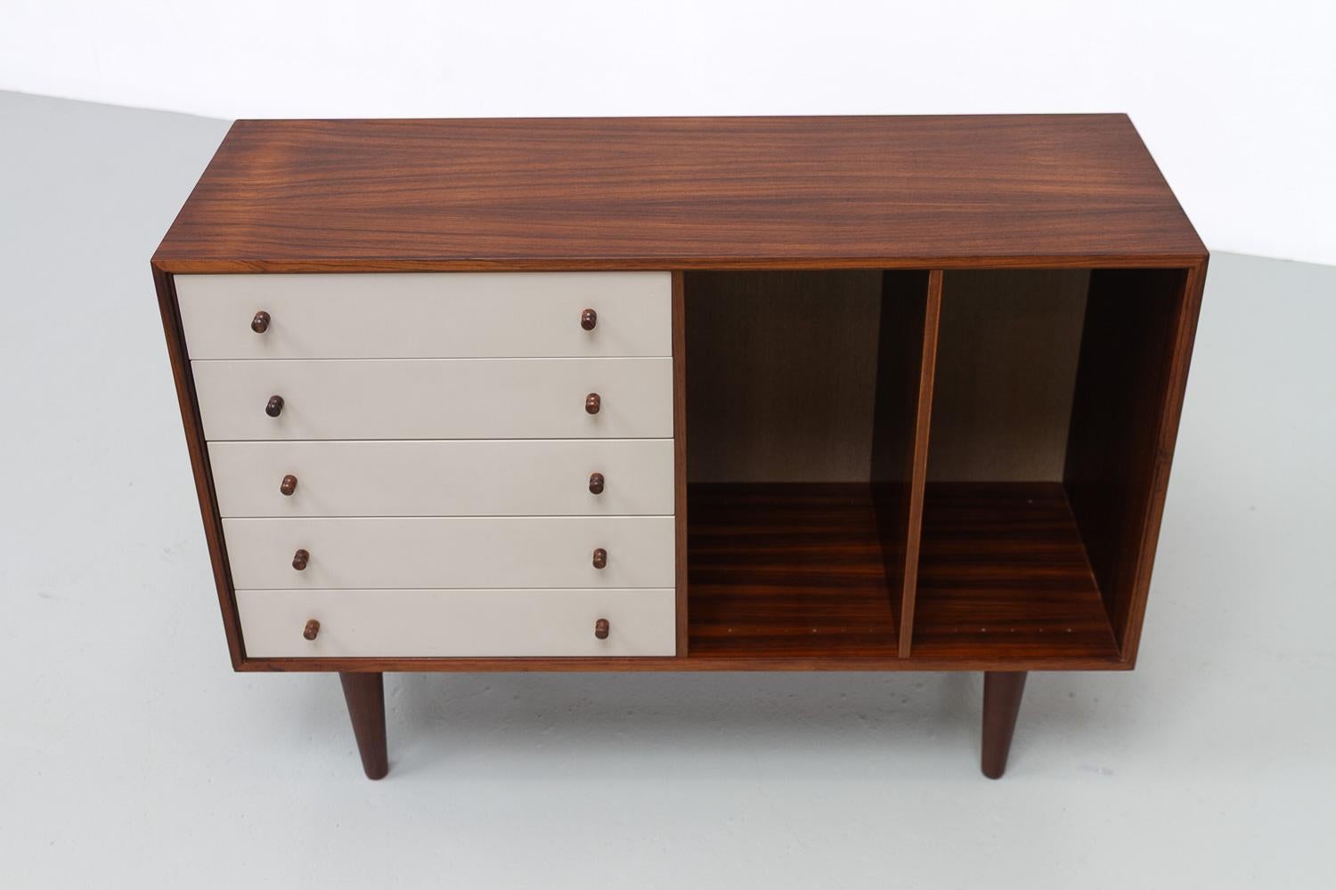 Danish Rosewood Sideboard with Drawers by HG Furniture, 1960s.

Scandinavian Mid-Century Modern small sideboard or dresser in Rosewood/palisander. Designed by Rud Thygesen and Johnny Sørensen for Hansen og Guldborg (HG Furniture Denmark) in the