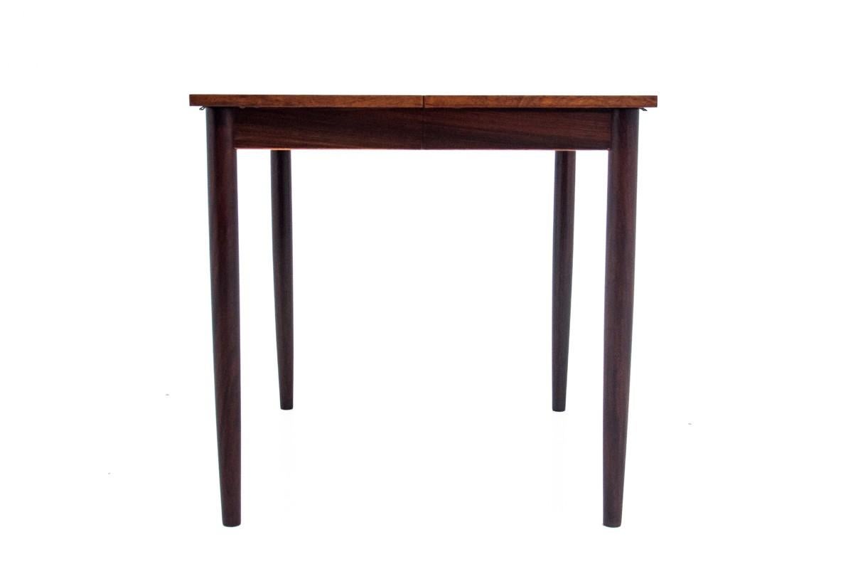 
 Dining table, manufactured in Denmark in the 1960s.

Furniture made of rosewood with beautiful grain. The unfolded, square version of the table will fit perfectly into small interiors due to its dimensions. The possibility of unfolding the