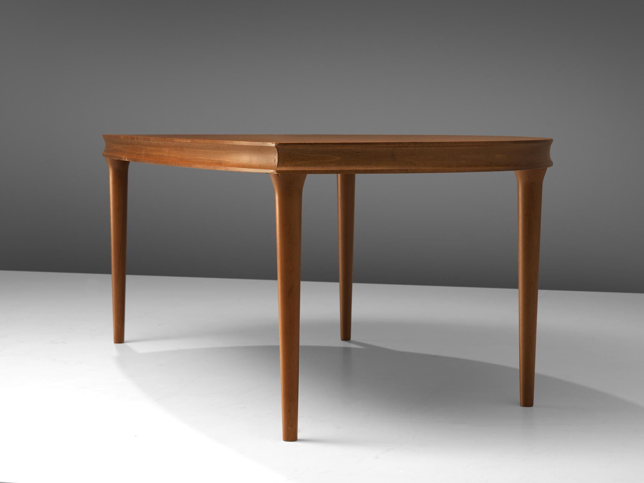 Coffee table, teak, Denmark, 1960s 

Beautiful half-round shaped coffee table in teak. This elegant table has an interesting appearance. The table top is half round, which makes a nice contrast to the tight and symmetrical shaped legs. Due the large