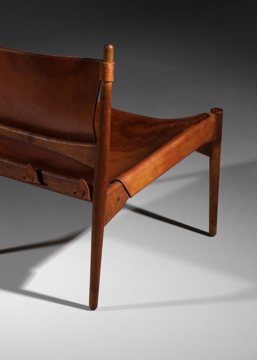Danish safari armchair in patinated leather and teak from the 60's For Sale 4