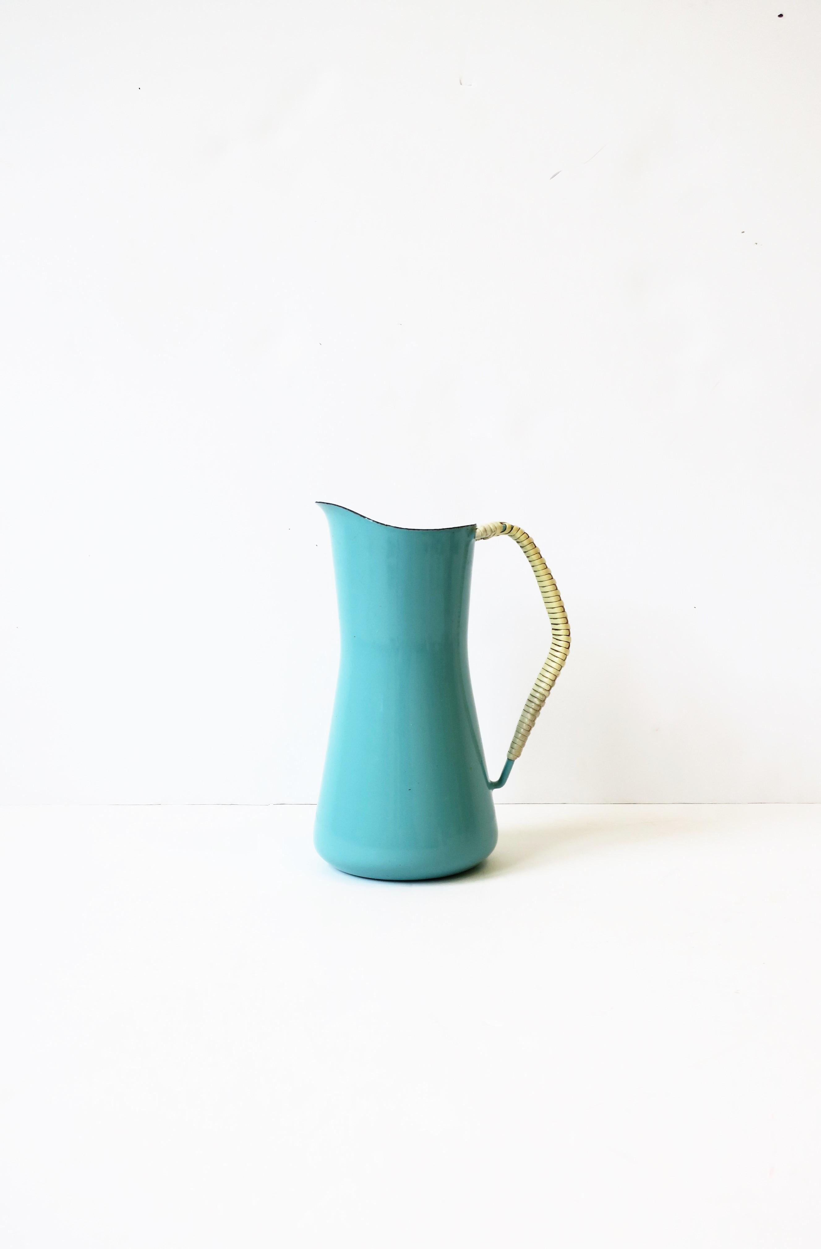 A vintage Dansk Kobenstyle Danish Scandinavian Modern turquoise blue enamel and white wicker wrapped handle pitcher, circa mid-20th century, Denmark. Great to use or display as a standalone piece of with flowers. Marked on bottom as shown.