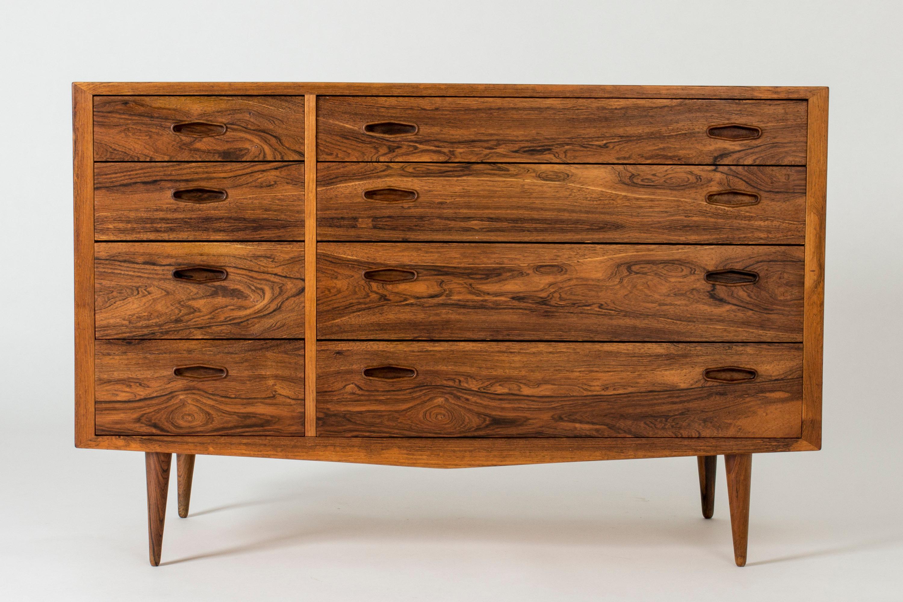 Cool Danish midcentury chest of drawers, made from rosewood with striking woodgrain. Clean, graphic lines.