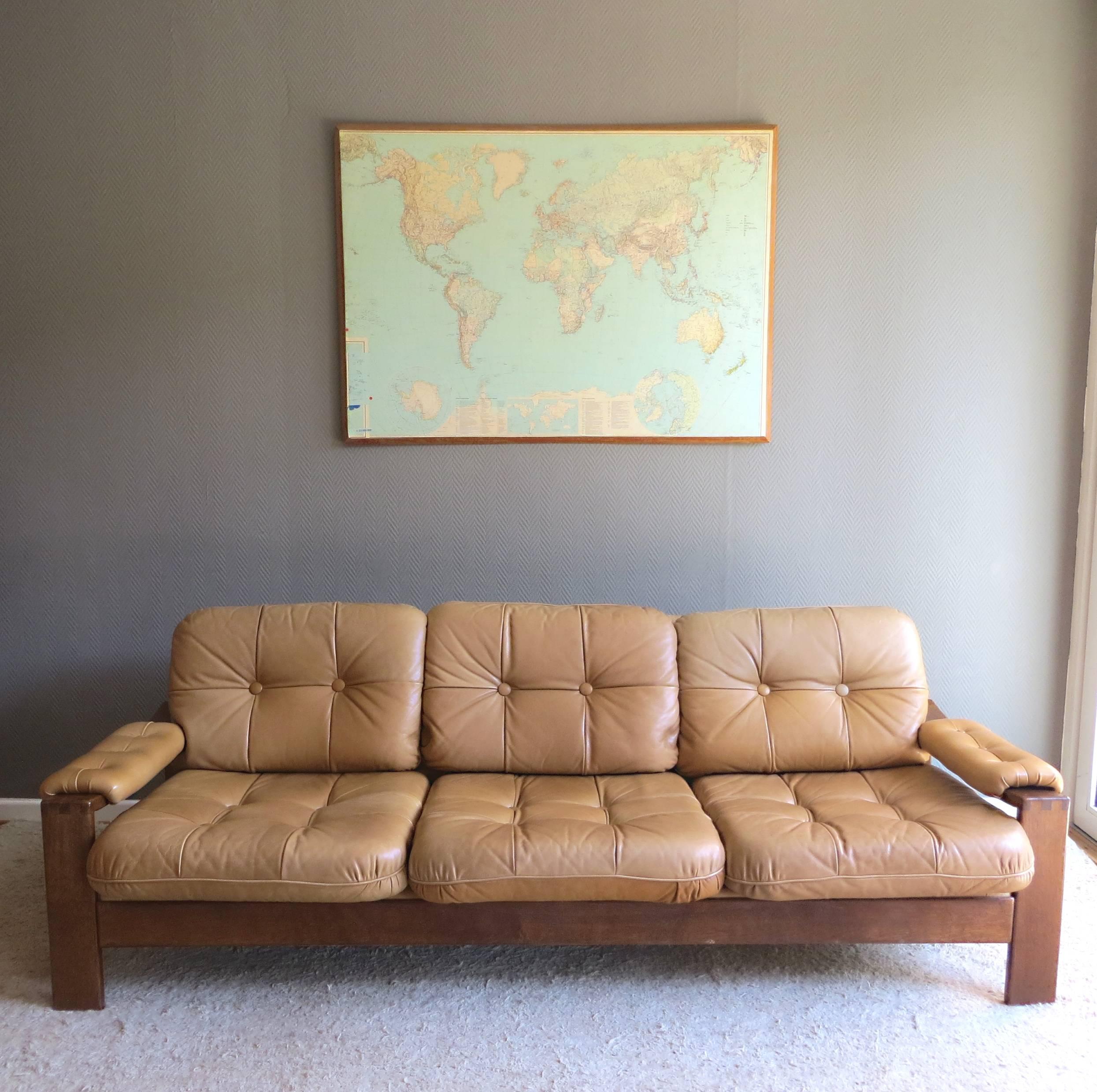 A very comfortable Mid-Century Modern cottage / lodge leather lounge sofa, from the late 1960s-early 1970s, is available here. 
The design is reminiscent of Esko Pajamies' 