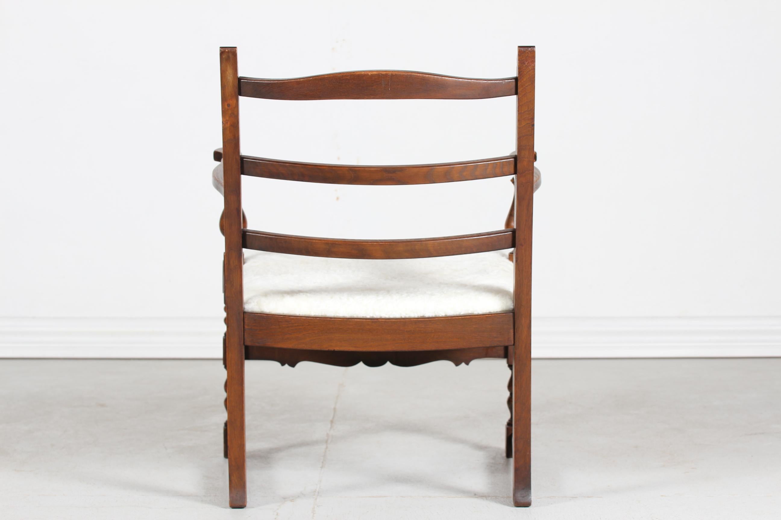 Danish Sculptural Handcrafted Armchair of Solid Oak with New Sheepskin 1940s (Volkskunst) im Angebot
