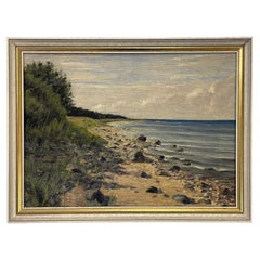 Danish seascape oil painting from the 1940s of sea meeting a rocky coastline