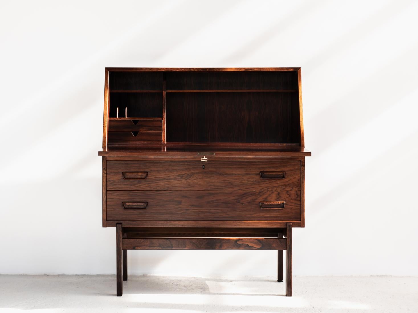 Midcentury secretary desk designed by Arne Wahl Iversen and manufactured by Vinde Møbelfabrik in Denmark in the 1960s. This beautiful secretaire has a practical organiser inside. There is 1 original key available. The secretary desk has a beautiful