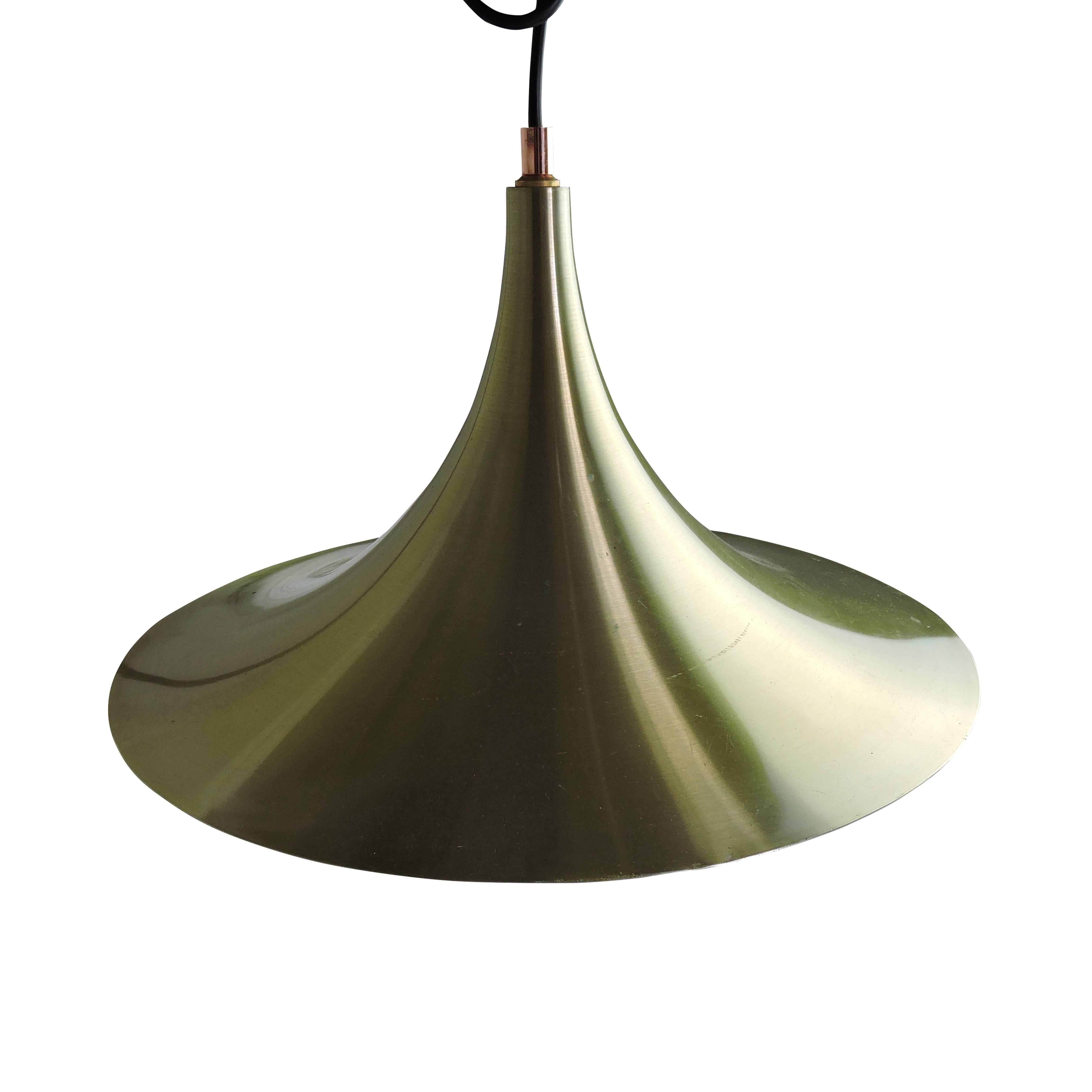 This Danish semi model pendant light was made by AKA and is labeled by the maker. The light has a brushed bronze exterior.
 