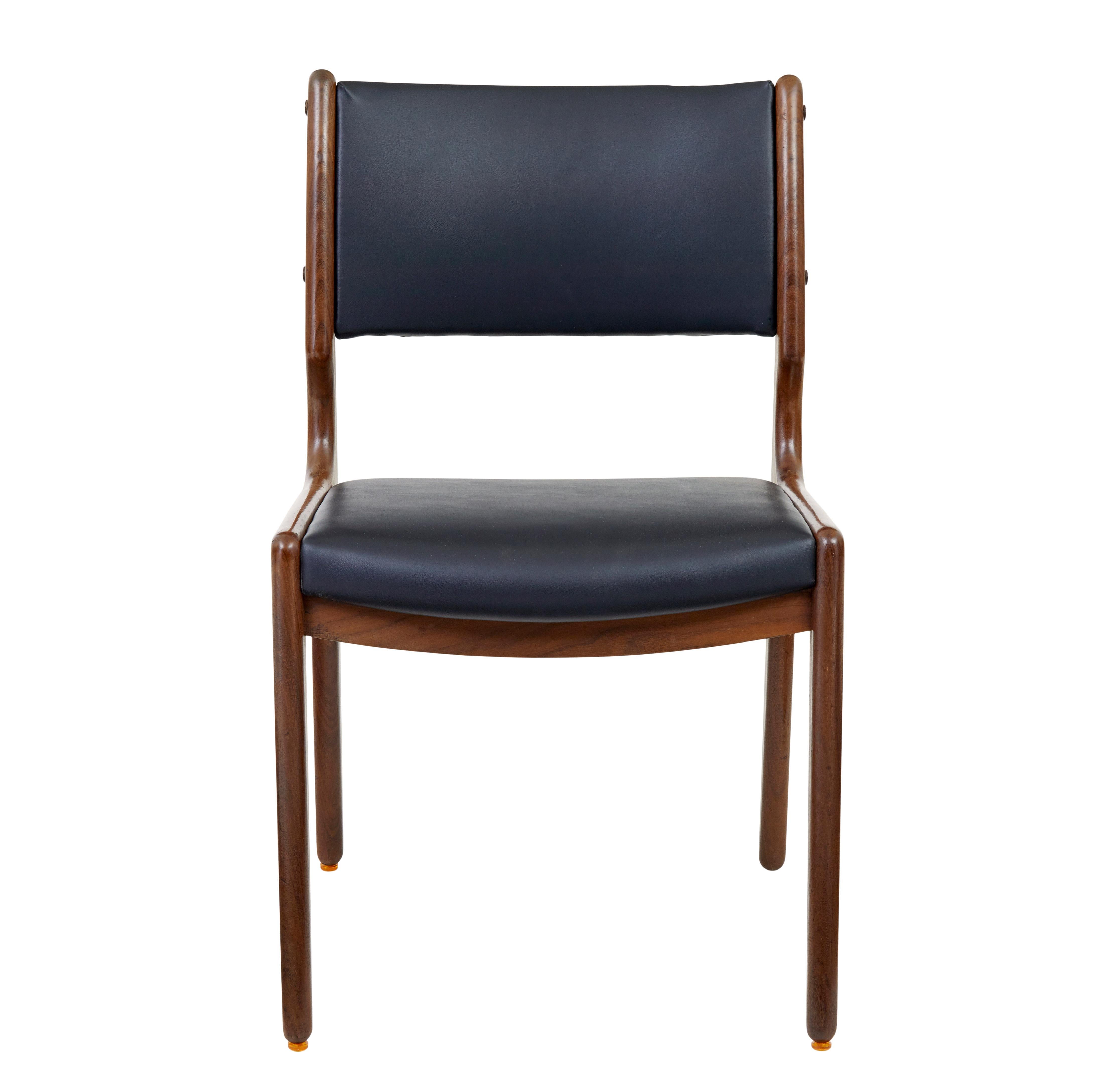 Danish set of 6 mid 20th century teak and leather dining chairs, circa 1960.

fine example of midcentury danish design. Presented in walnut coloured teak and upholstered in a supple black faux leather.

Show frame design which allows us to see