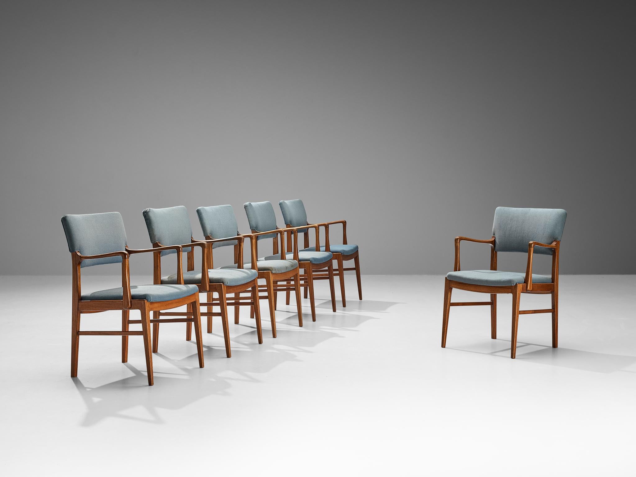 Set of six armchairs, fabric, mahogany, Denmark, 1960s

This set of six dining chairs of Danish origin is characterized by excellent craftsmanship and elegant silhouettes. The frame has an organic appearance due to the subtle curves in the armrests,