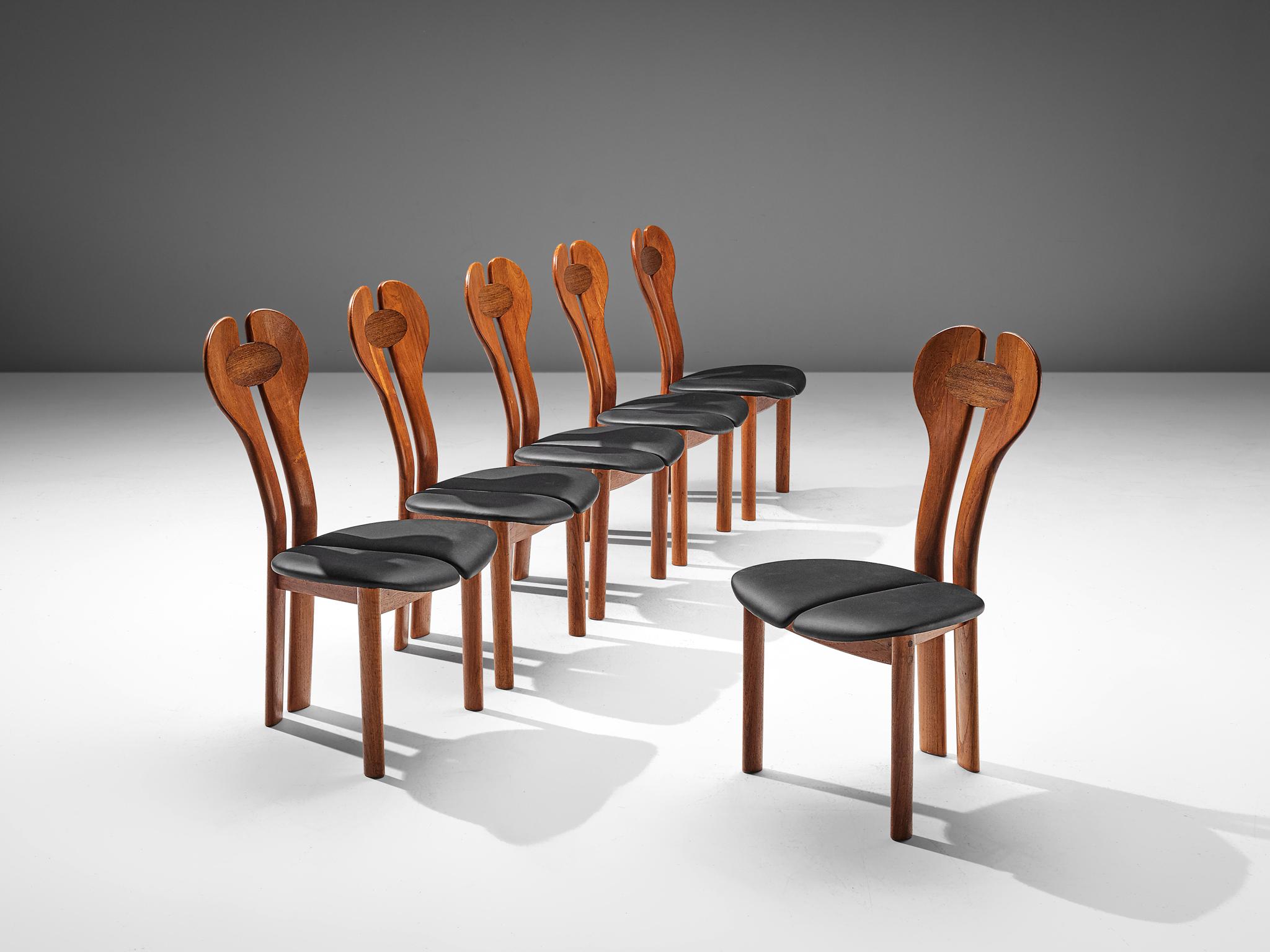 Set of six dining chairs, teak, Wenge and leather, Denmark, circa 1960.

A sculptural set of six Danish modern dining chairs. The capricious frame with a remarkable backrest consists of two parts, starting as the hind legs that flow over in the