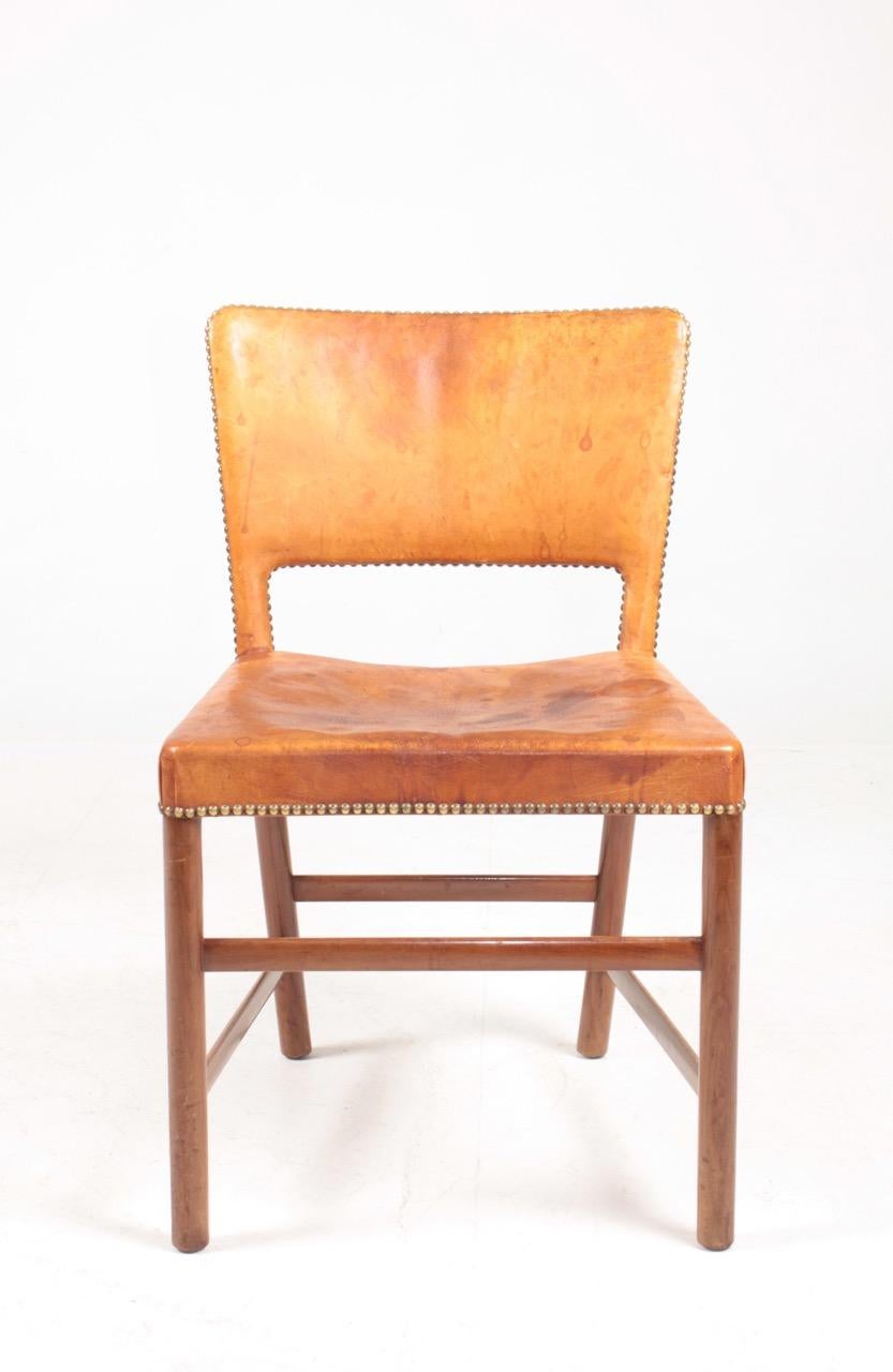 Danish side chair in patinated Niger leather and mahogany. Designed and made in Denmark, great original condition.