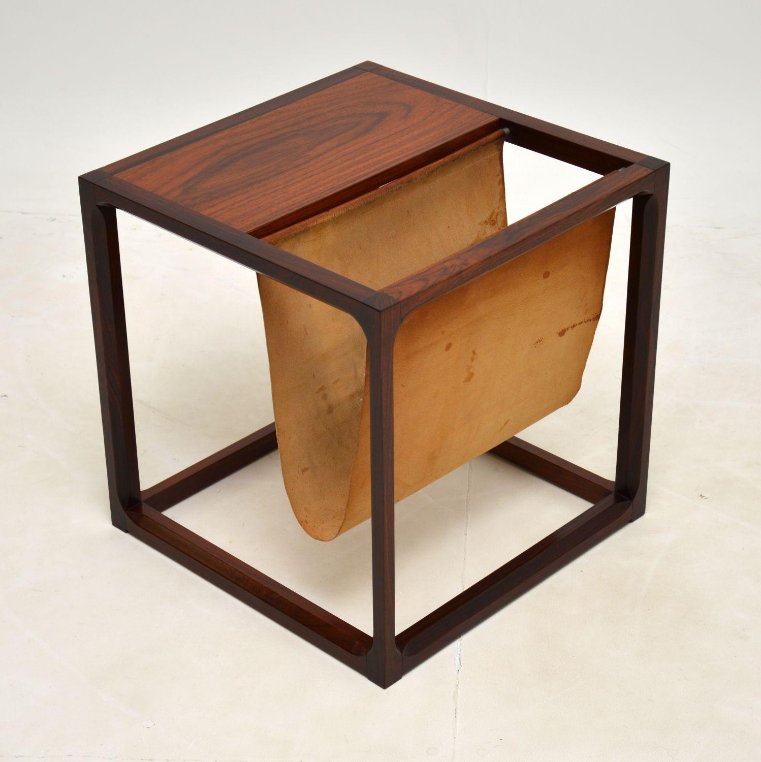 A stunning vintage Danish side table / magazine rack in wood and leather. This was made by Aksel Kjersgaard, and was designed by Kai Kristiansen. It was made in Denmark, and dates from the 1960’s.

This is a gorgeous and very useful item, it is