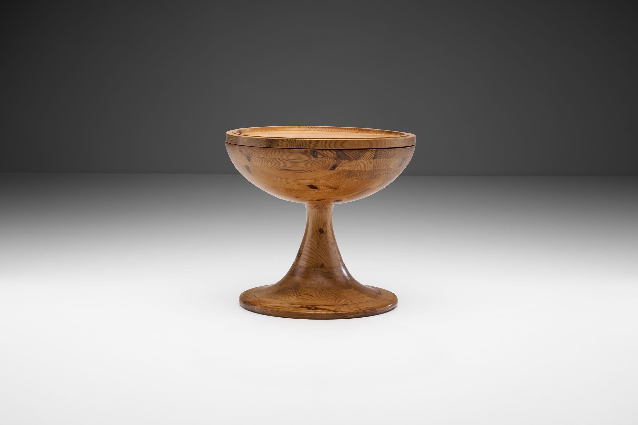 This unique solid pine table is quite elemental in its design despite its humble size. Functional and distinctive, this table stands out as a remarkable piece from the 1970s.

The design is very successful in balancing larger volumes with clean