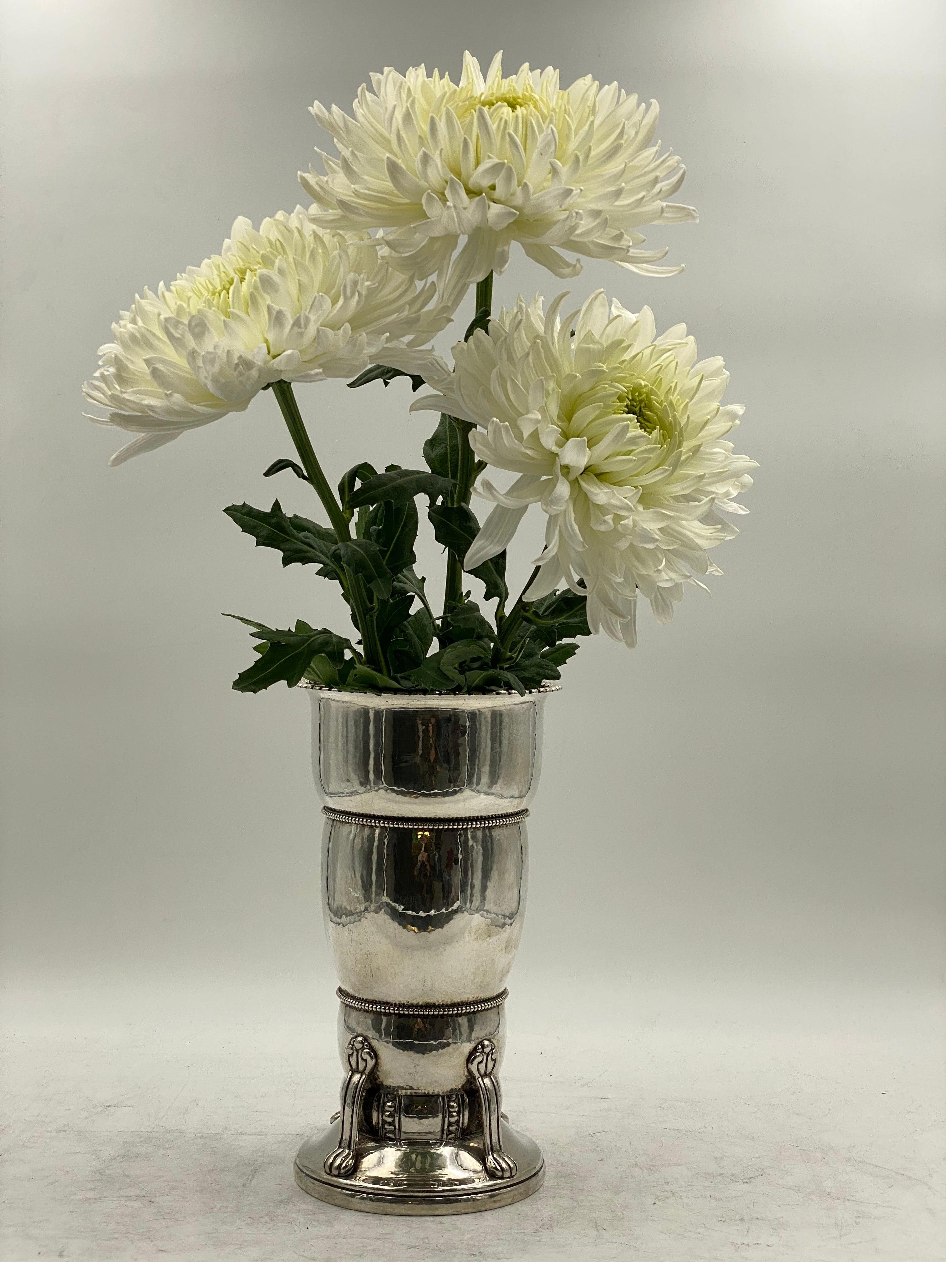 Early 20th century continental 0.826 Danish silver hand hammered vase with beaded rims, inscriptions, and applied decorations by Christian F. Heise. Measuring 10 1/8'' in height by 5 1/2'' in diameter at the top and weighing 23.1 ozt. Bearing