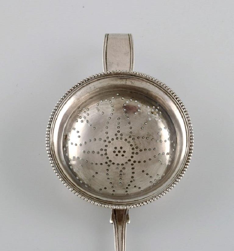 Danish silversmith. Antique silver 830 tea strainer. 
Dated 1852.
Length: 19 cm.
In excellent condition.
Stamped.
Large private collection of European silver tea strainers.