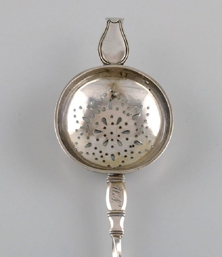 Danish silversmith. Antique silver 830 tea strainer. 
Dated 1864.
Length: 19 cm.
In excellent condition.
Stamped.
Large private collection of European silver tea strainers.