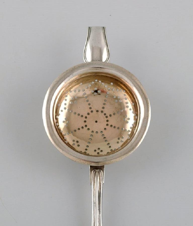 Danish silversmith. Antique silver 830 tea strainer. 
Dated 1873.
Length: 19 cm.
In excellent condition.
Stamped.
Large private collection of European silver tea strainers.