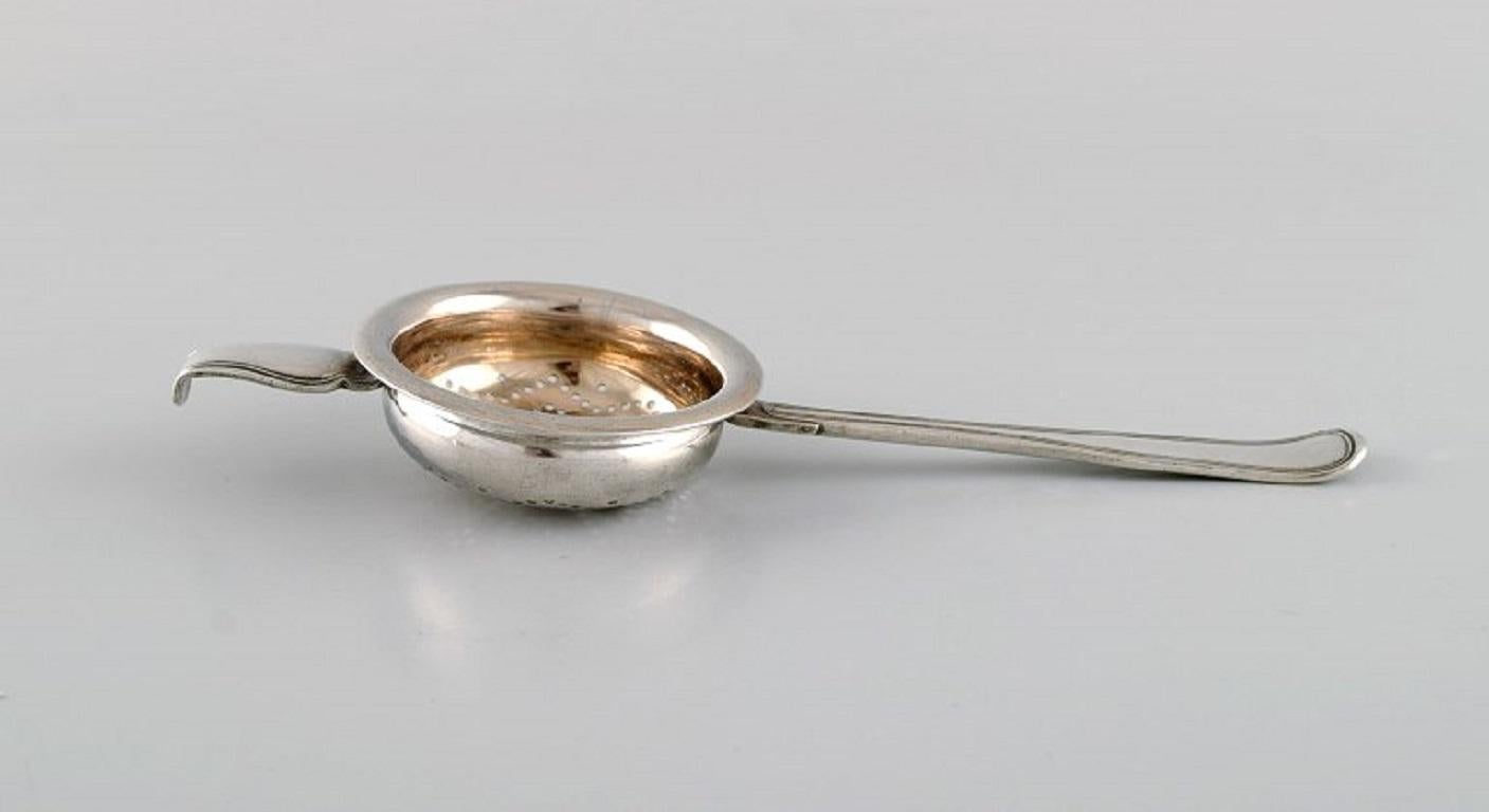 Late 19th Century Danish silversmith. Antique silver tea strainer. Dated 1873 For Sale