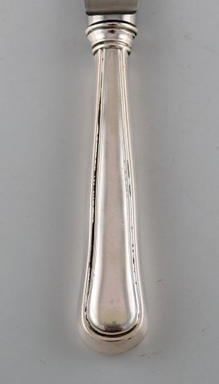 Danish silversmith. Lunch knife in silver. 1935.
3 pcs in stock.
In very good condition.
Stamped.
Measures: 20.5 cm.