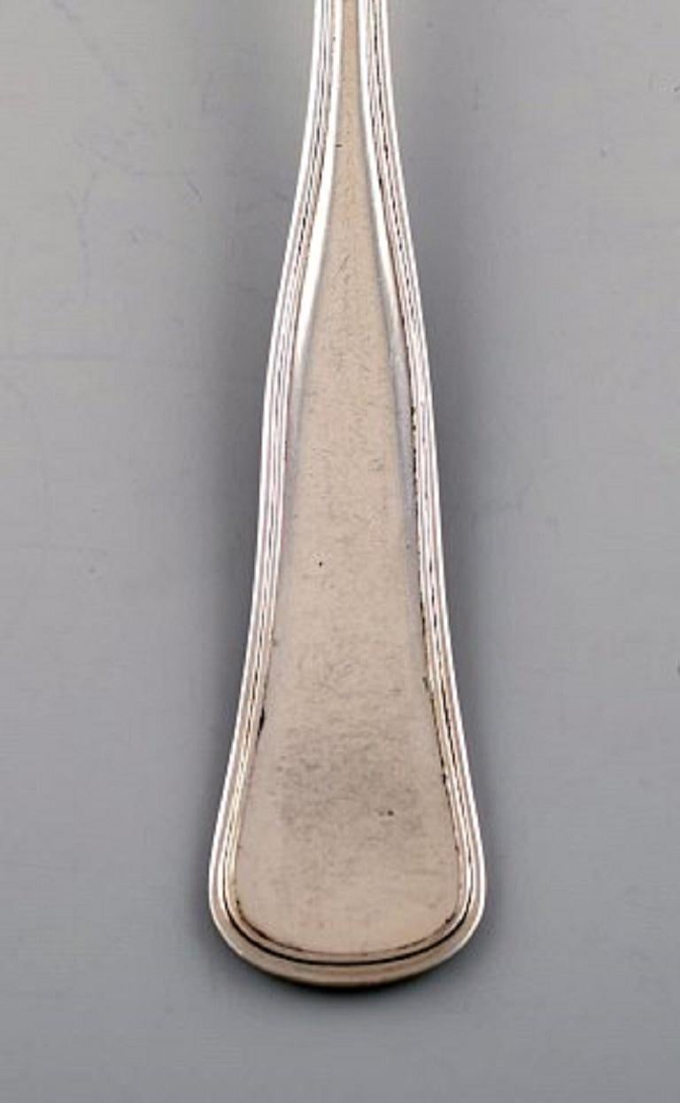 Danish silversmith. Old Danish fork in silver. 1920s-1930s.
In very good condition.
Stamped.
Measures: 18 cm.
4 pieces in stock.