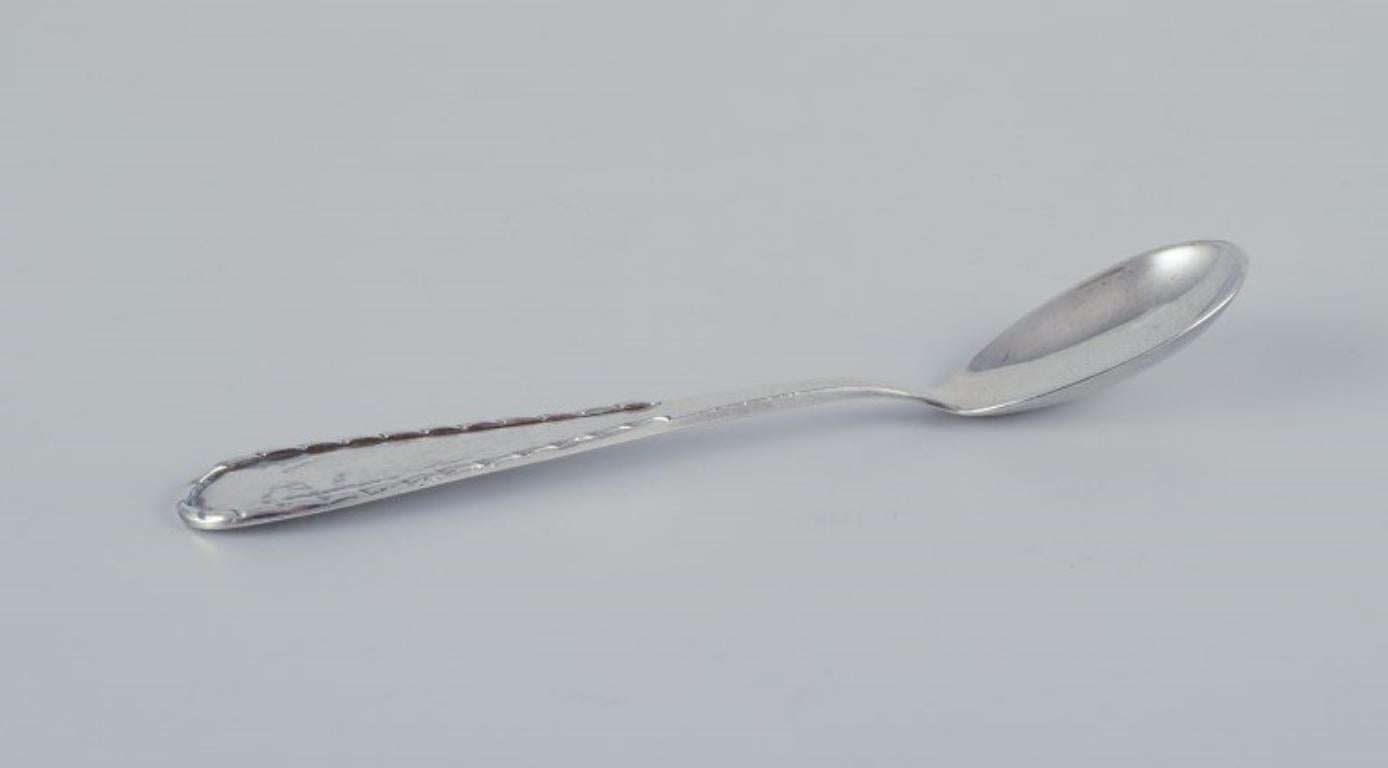 Mid-20th Century Danish silversmiths, including Heimbürger and others. Set of five spoons For Sale