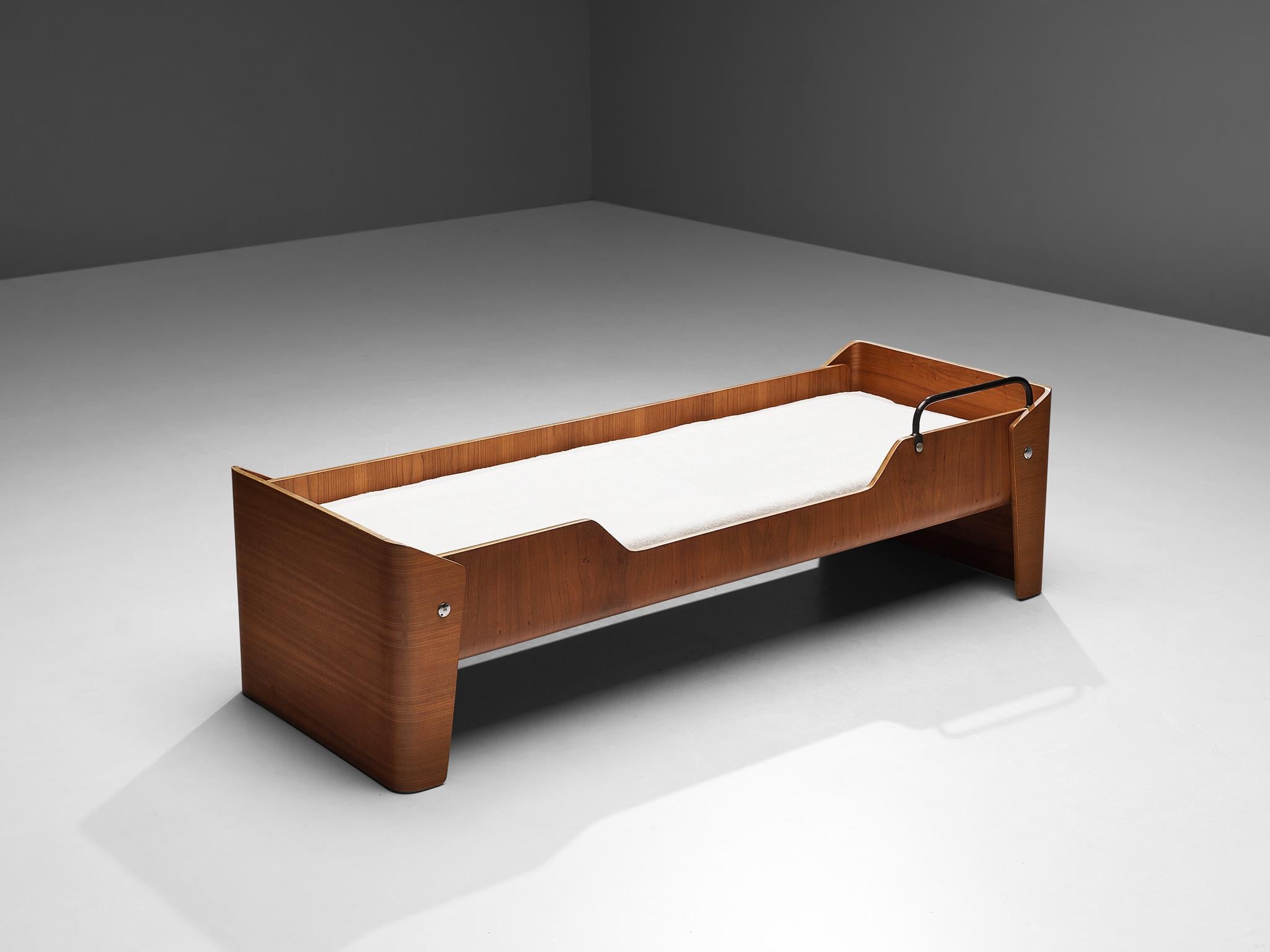 Single bed, elm, metal, Denmark, 1960s 

This elegant bed is executed in elm and the color and grain are deep and warm. It is the color and richness of the wood that defines this slim and elegant frame. The shorter ends of the bed are pulled